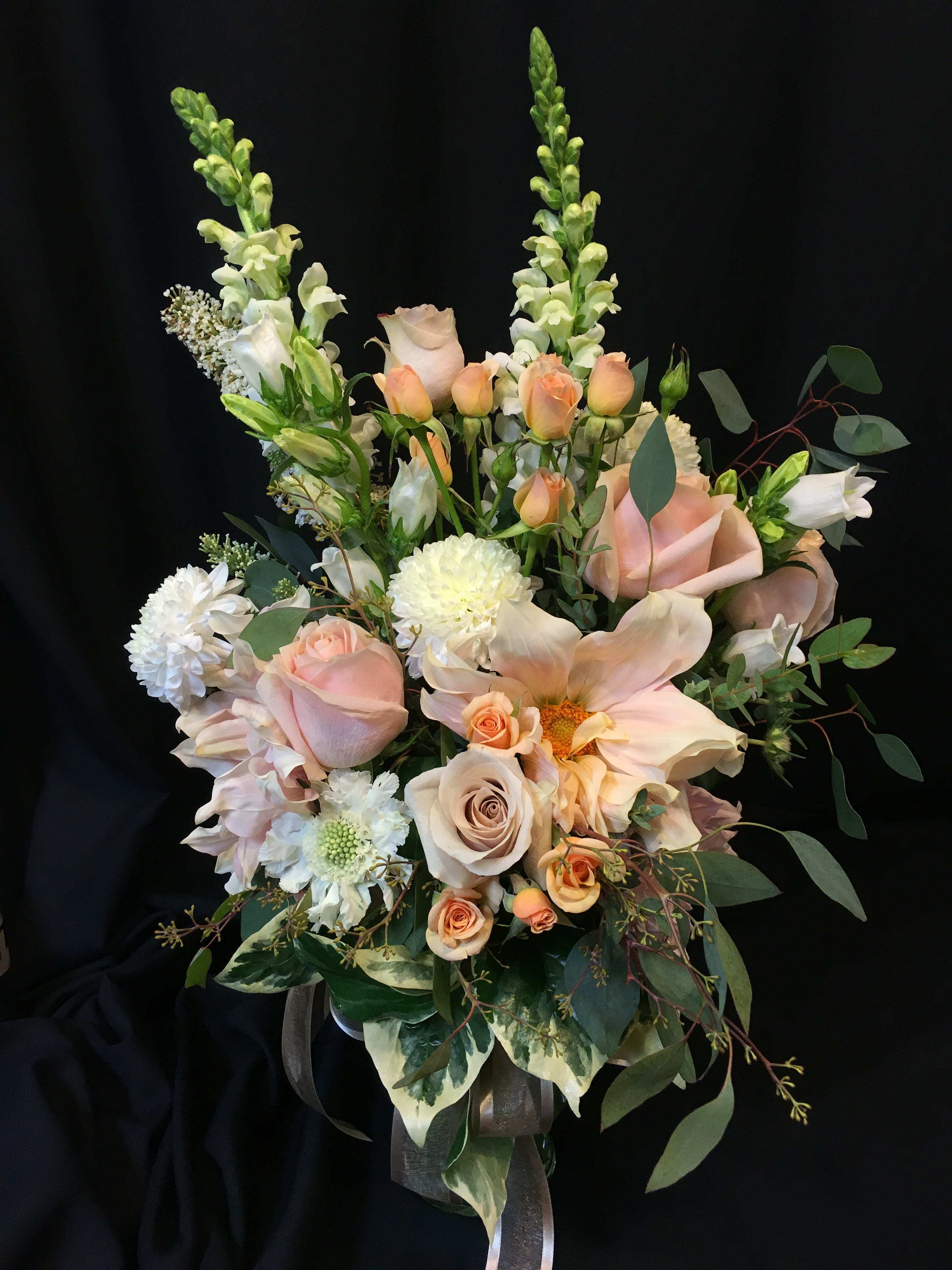 Natural romance bouquet - Shades of romance and blushing color. Premium flowers such as Dahlia, roses, cremon, pincushion but assortment will vary by season and availability. 