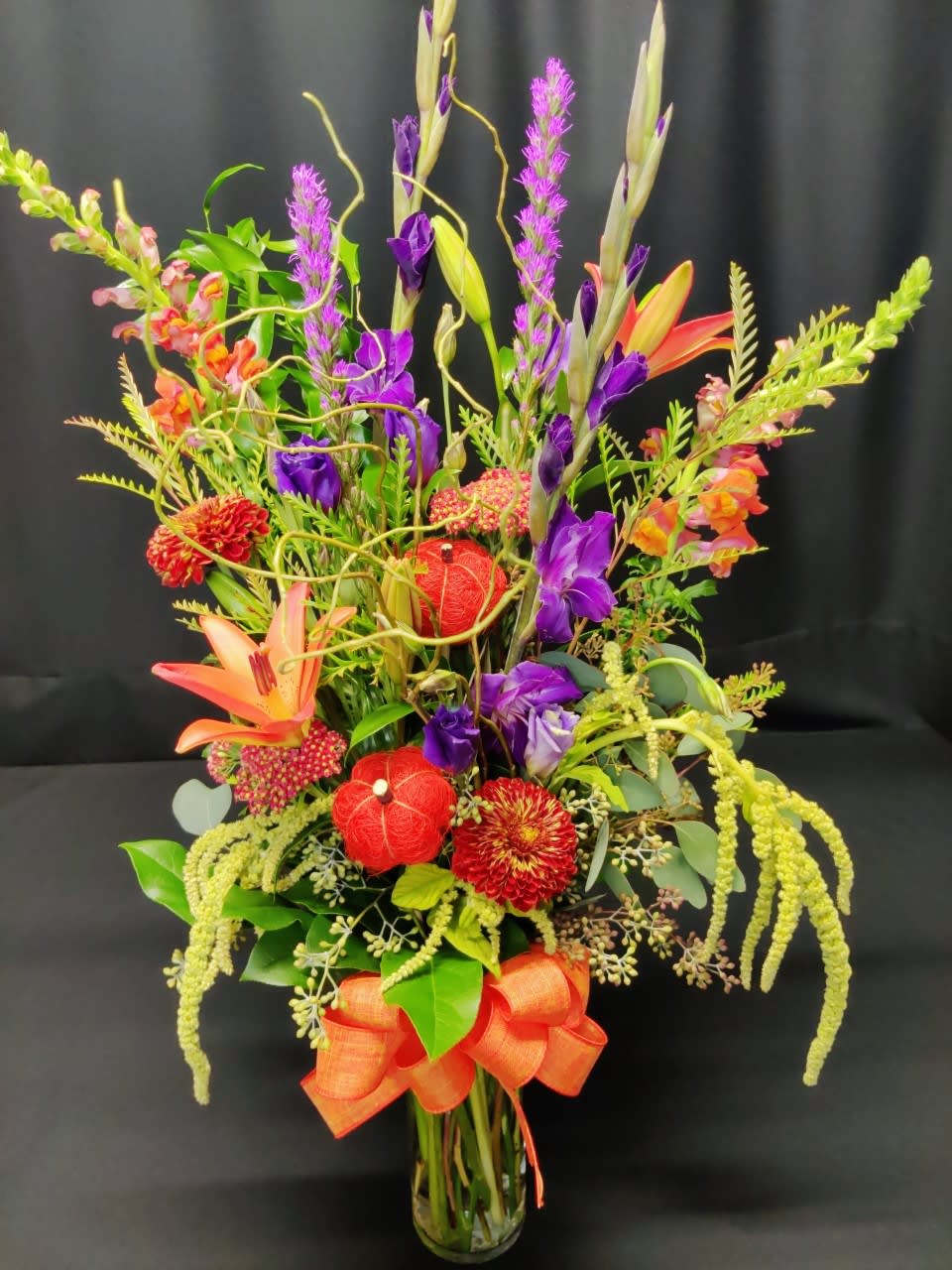 Autumn pumpkin tall mix - Bright and lively fall mix of flowers, will vary. Accent items and pumpkins too! Super sweet and striking display to welcome the fall season. 