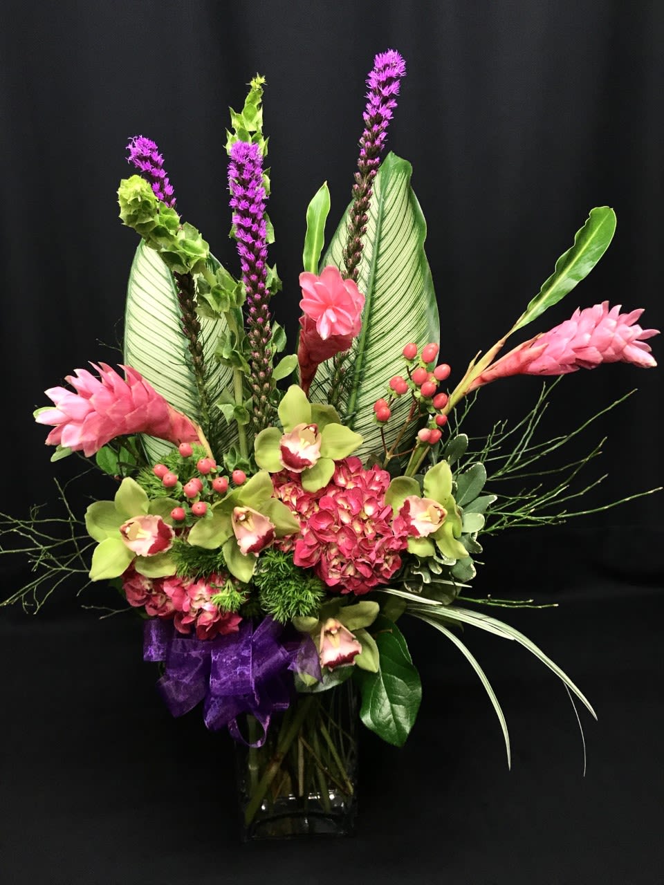 Exotic Fantasy Valentine - Exotic look and beautiful fantastic color. Tall and Tropical /exotic  Travel to an exotic paradise, if only in your mind, with this valentines bouquet. We select only the finest exotic accent flowers, orchids and ginger* upon availability.  Colors and flowers may vary.