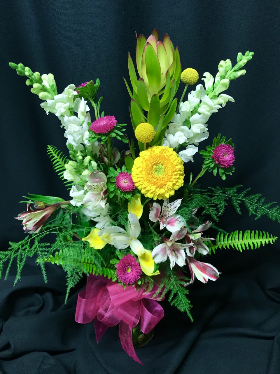Let's Brighten Things Up Bouquet - It feels good to send a treasured friend or a valued employee a happy little pick-me-up when times get tough.  Large or small, Flower Fiesta will put loving care into your flower arrangement. This is a small mixed bouquet but packed with joy and delight.  Assortment and colors will vary.  Great choice for a Get Well Bouquet or I'm Here for You Bouquet!