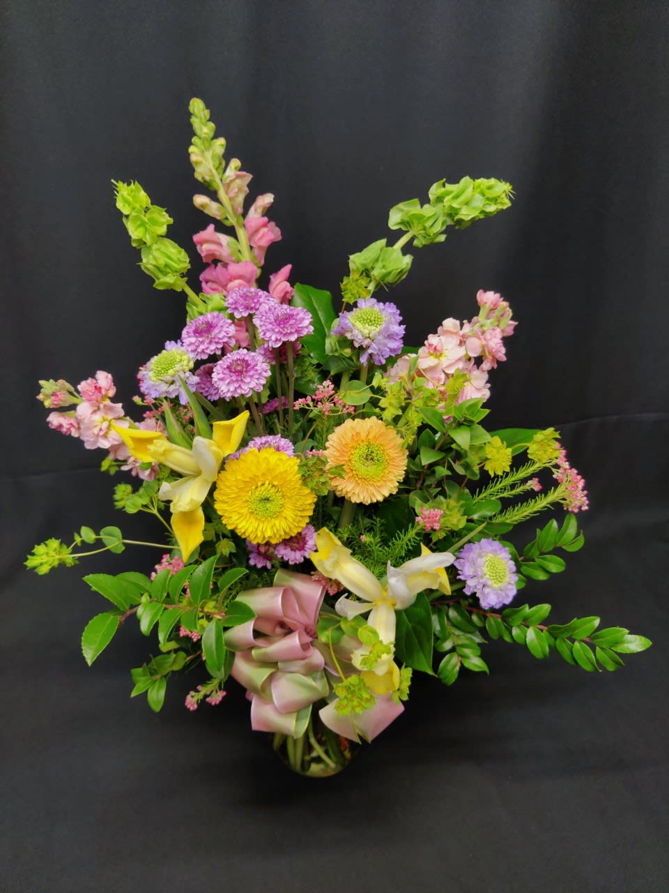 Mixed bouquet with yellow lilies, purple mums, and pink flowers