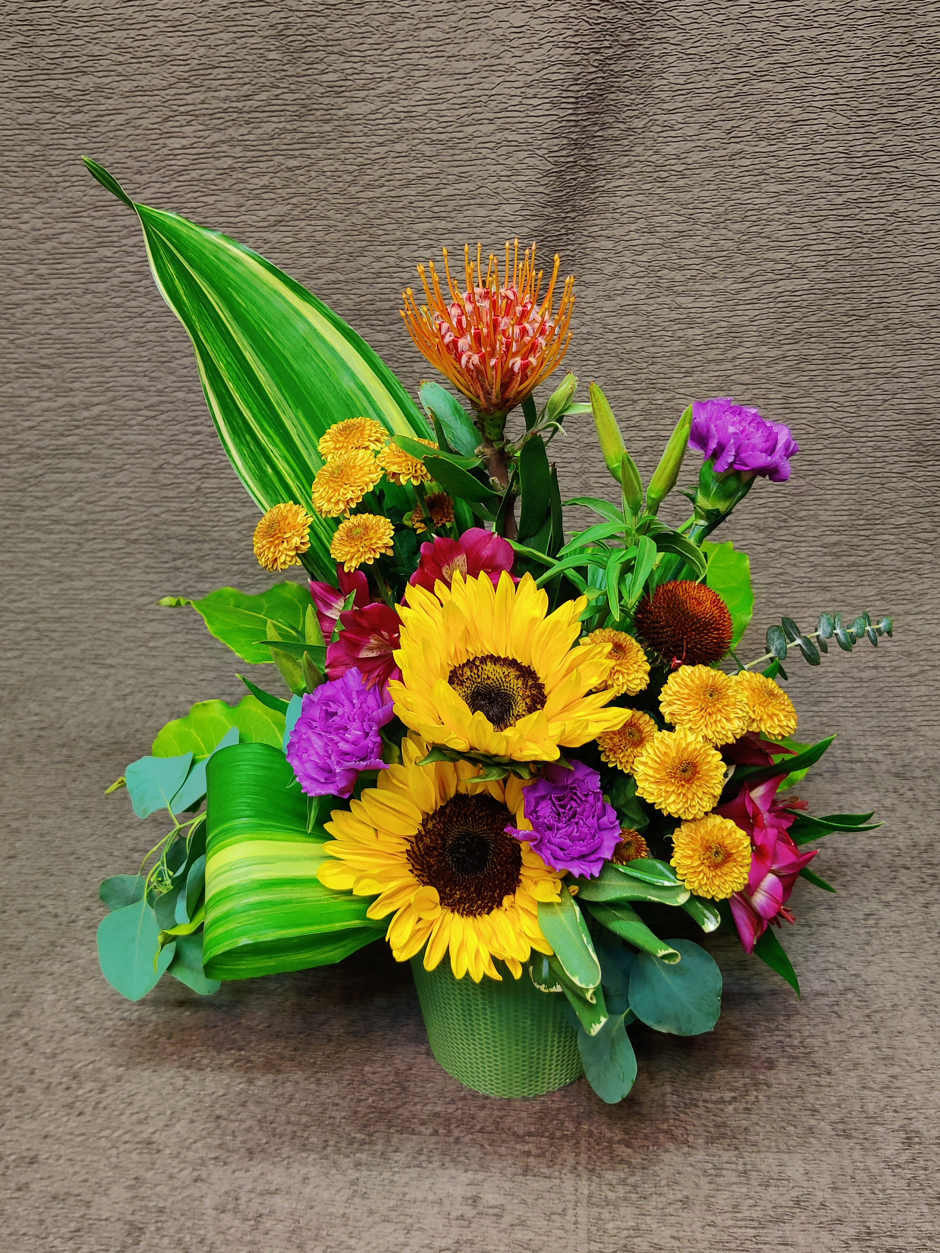 Modern Petite Pot, Bold Color - Flowers and container will vary. Colorful bright and festive. Perfect birthday or congratulations bouquet!