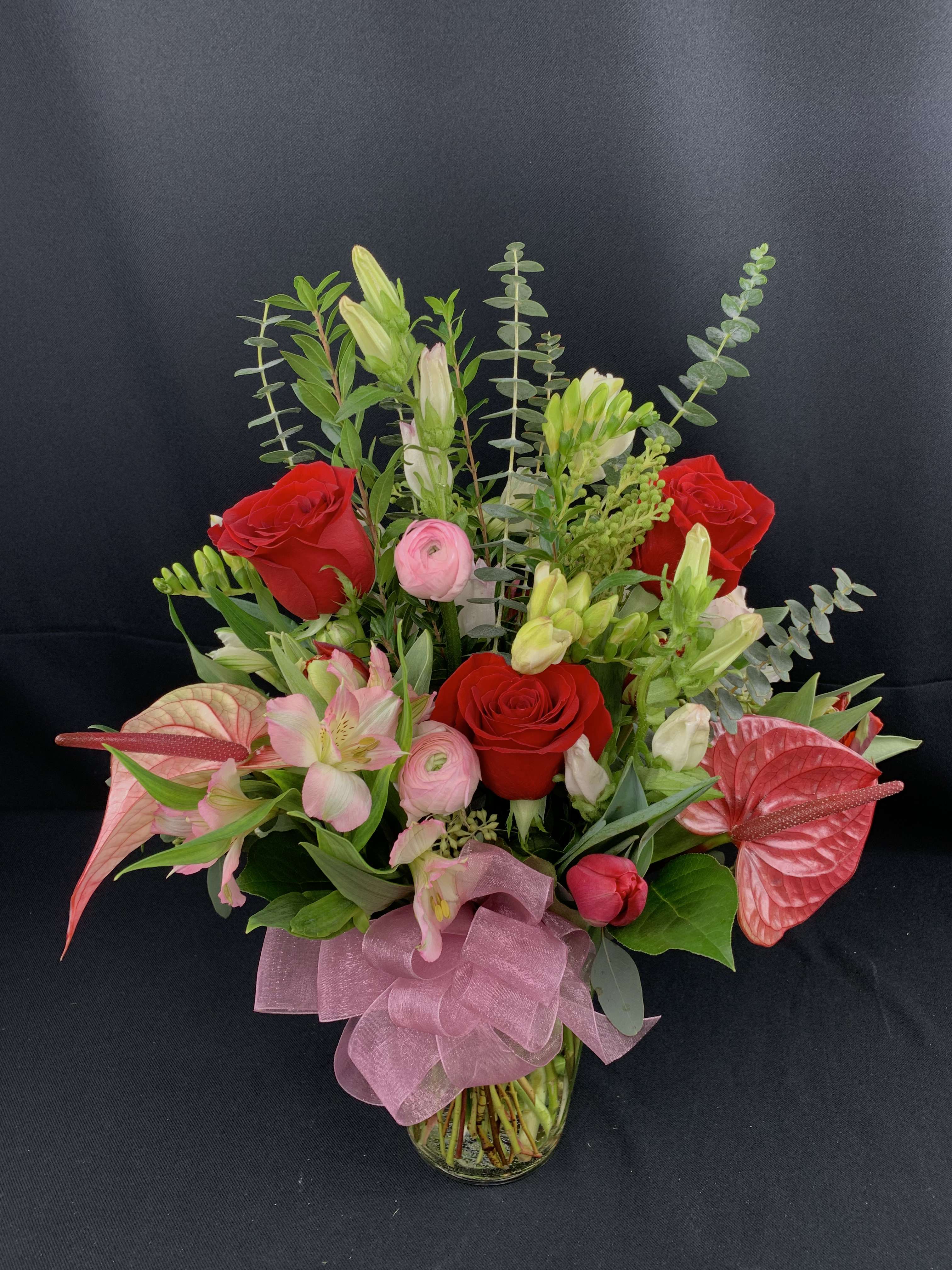 Exotics and Roses for Valentine's Day - Unique combination of roses and exotic flowers for your valentine such as these prized anthurium and ranunculus.   Flowers and colors will vary.  Be sure to order at least 3 weeks prior to Valentine's day.  Gorgeous choice for an anniversary.