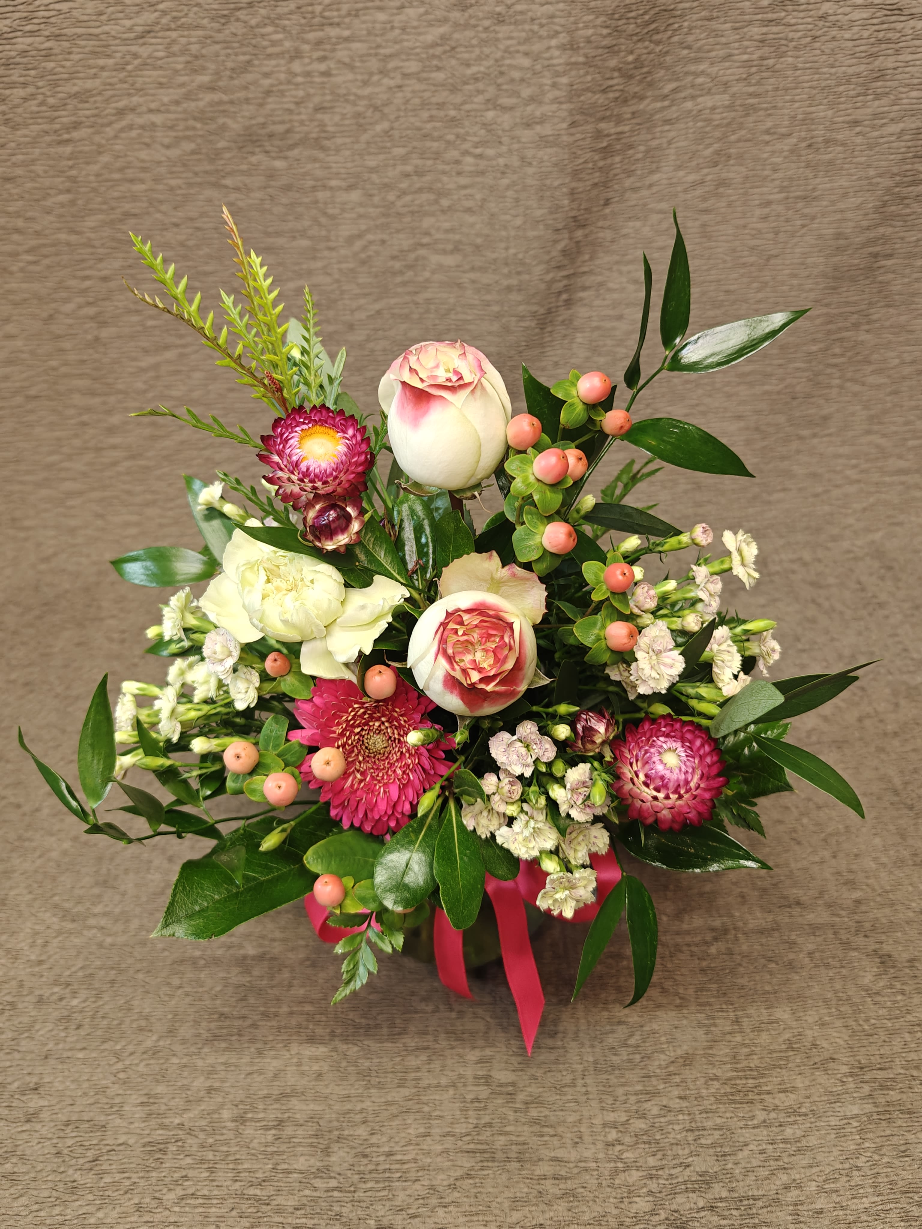 Small Double Rose Bud Vase  - 2 lovely colored roses and accents in a small vase. A sweet pick-me-up, thank you or get well. Colors and flowers may vary. 