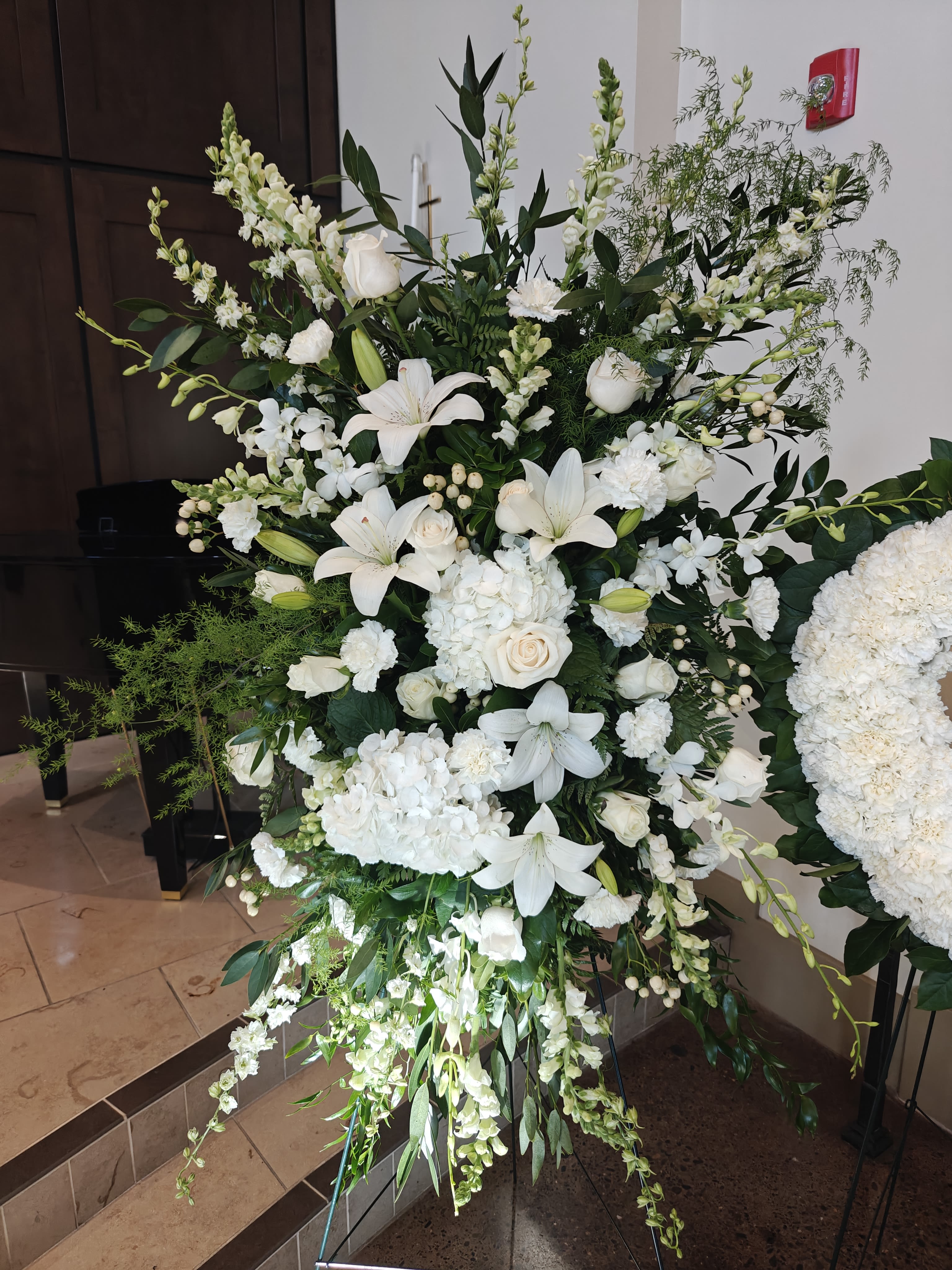 Spray of All White Flowers - Large spray on an easel. All White unless you choose another flower color in advance (we must confirm). Be sure to order at least a week ahead if possible. Flowers will vary. 