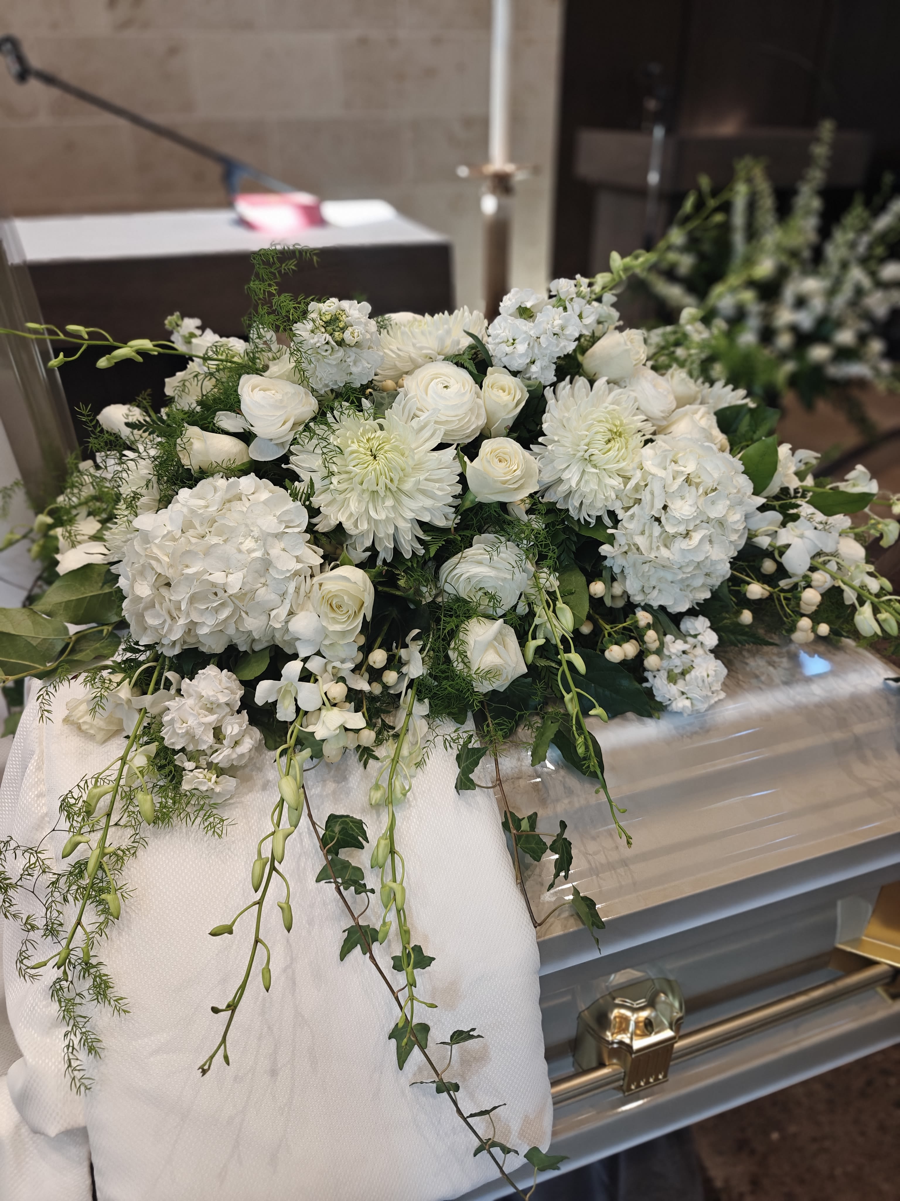 Casket Flowers, Large, Select your own Colors - This price point is for Designer's Choice of flowers, using premium flowers. We can customize with your color choice(s) when you order at least a week ahead. Flowers will vary.   Casket design is approximately 3-4' wide. It is large enough for a full (closed) Casket or a half (open ) Casket. We also have a larger size for only a closed casket.
