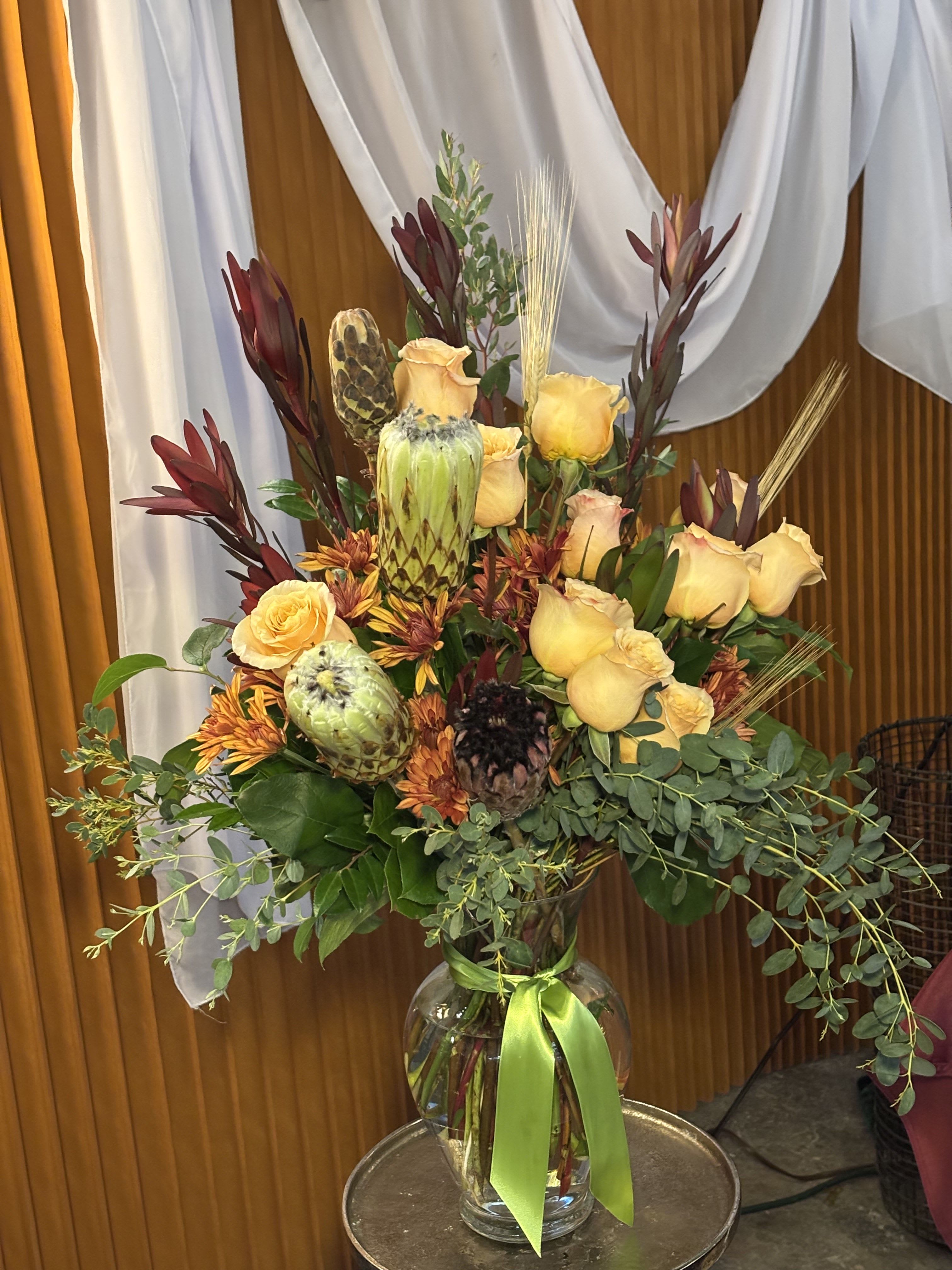 Maple &amp; Moss - Maple &amp; Moss is a sophisticated fall-inspired floral arrangement that captures the essence of autumn’s natural beauty. Featuring rich textures, warm earthy tones, and seasonal greenery, this arrangement evokes cozy elegance and refined style. Perfect for home décor, seasonal centerpieces, corporate spaces, and thoughtful gifting, Maple &amp; Moss is handcrafted by a Downtown Seattle florist, offering luxury floral arrangements that bring the warmth and richness of fall to any space.