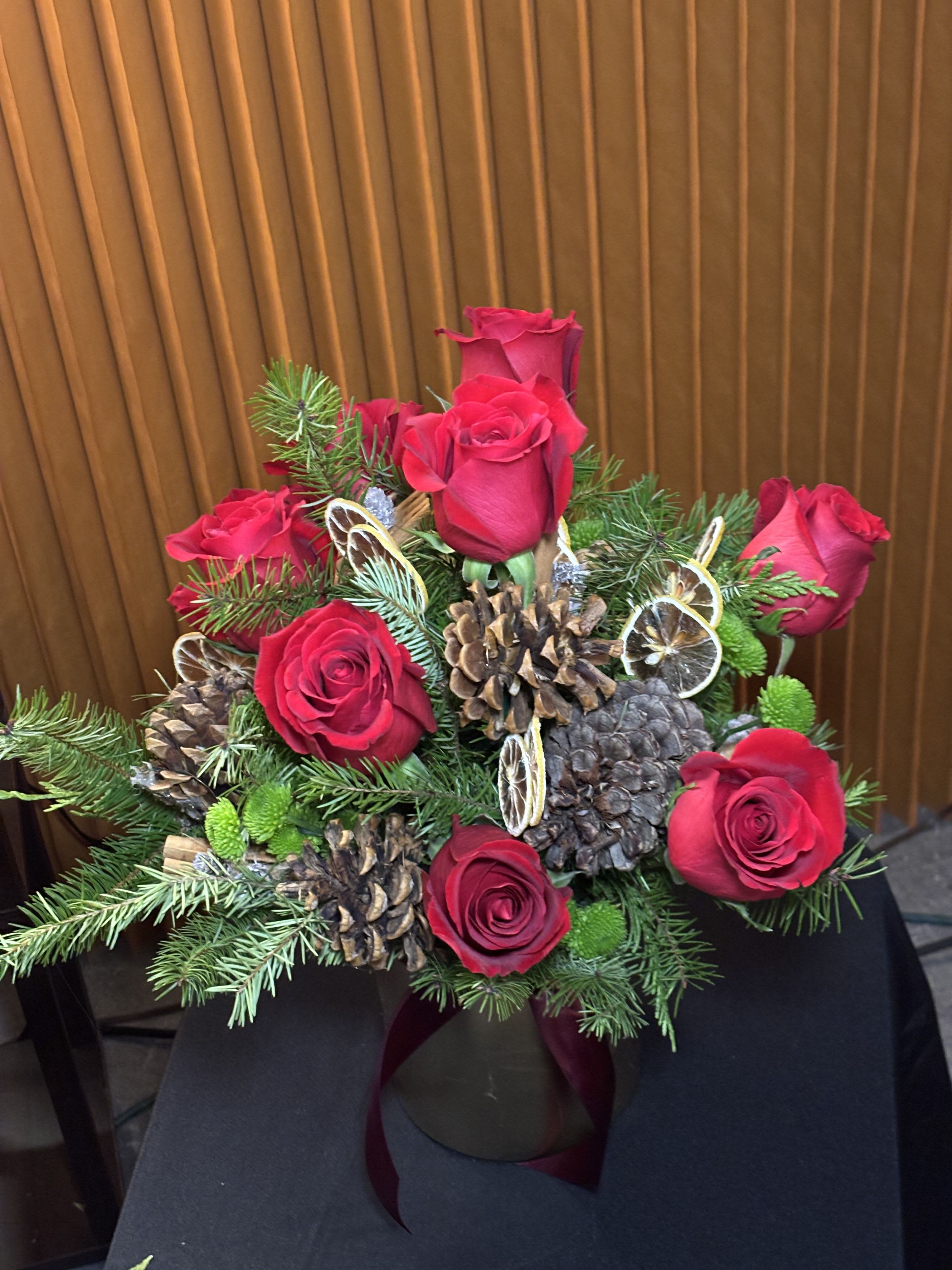 Velvet Holly - Velvet Holly is a luxurious Christmas floral arrangement designed to bring timeless elegance to the holiday season. Featuring rich seasonal greenery such as pine, cedar, and holly, this arrangement is accented with velvety red blooms and deep festive tones that create warmth, texture, and sophistication. Ideal for holiday décor, Christmas centerpieces, and seasonal gifting, Velvet Holly is handcrafted by a Downtown Seattle florist, offering premium floral arrangements that elevate homes, hotels, and private events with a refined holiday aesthetic.