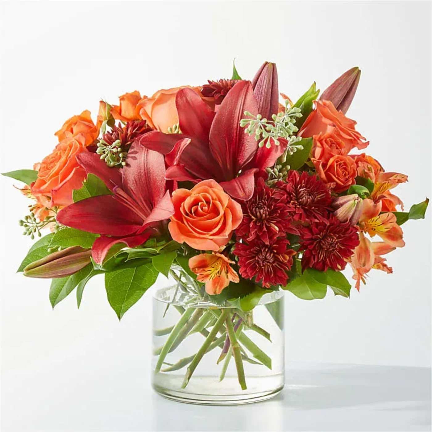  Crimson Leaves Bouquet  - Capturing the colors of fall foliage, the Crimson Leaves Bouquet is an eye-catching mix of deep reds and oranges, sure to add a smile to your recipient’s day.