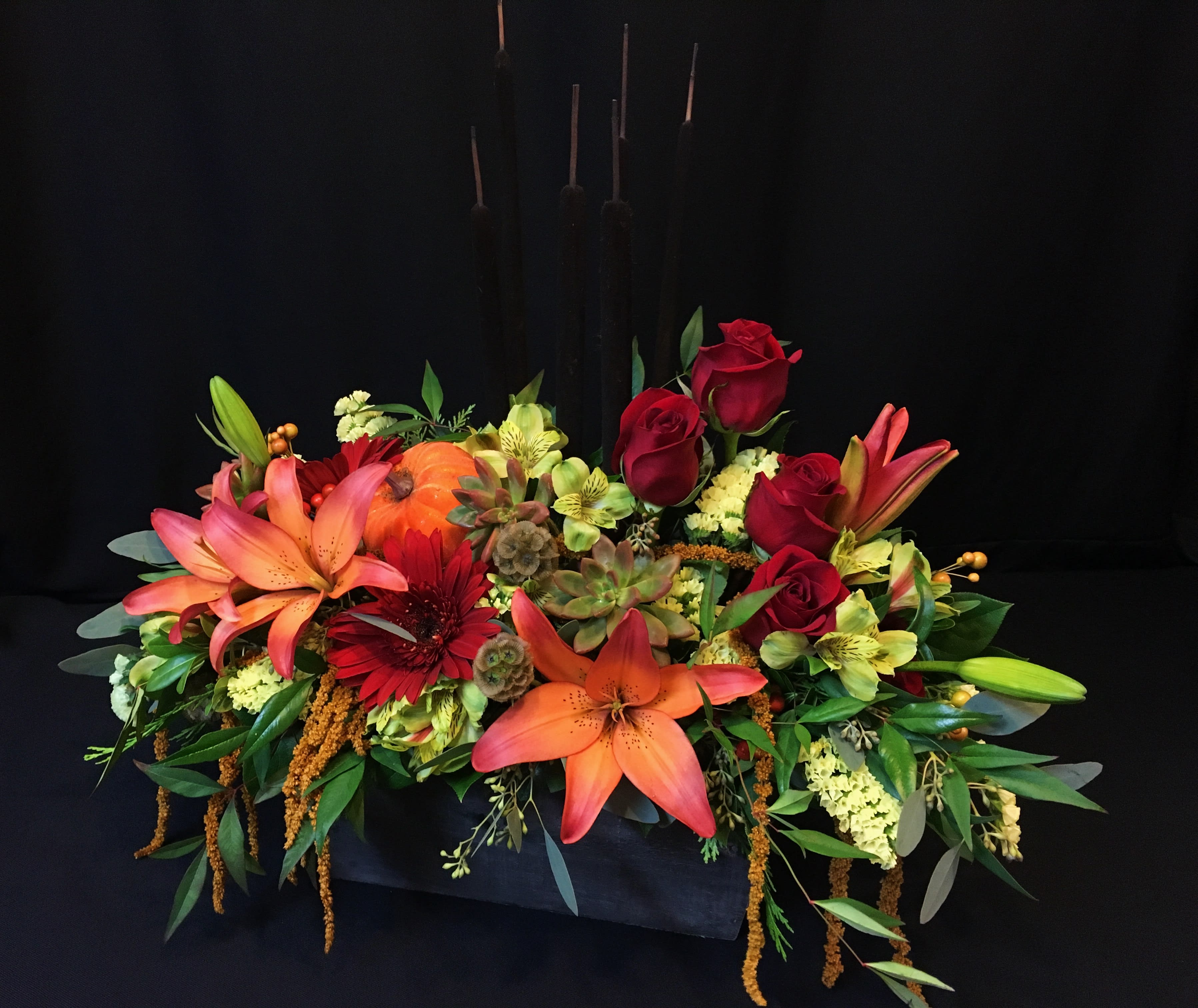 Fall Rose box Mix with Cattails - Rustic box of fall flowers and roses. Colors and items will vary. Cattails up top make this a super fun arrangement that makes any tabletop festive. 