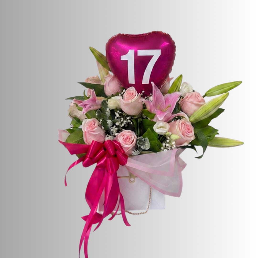 Pink rose bouquet with lilies and a heart-shaped "17" balloon