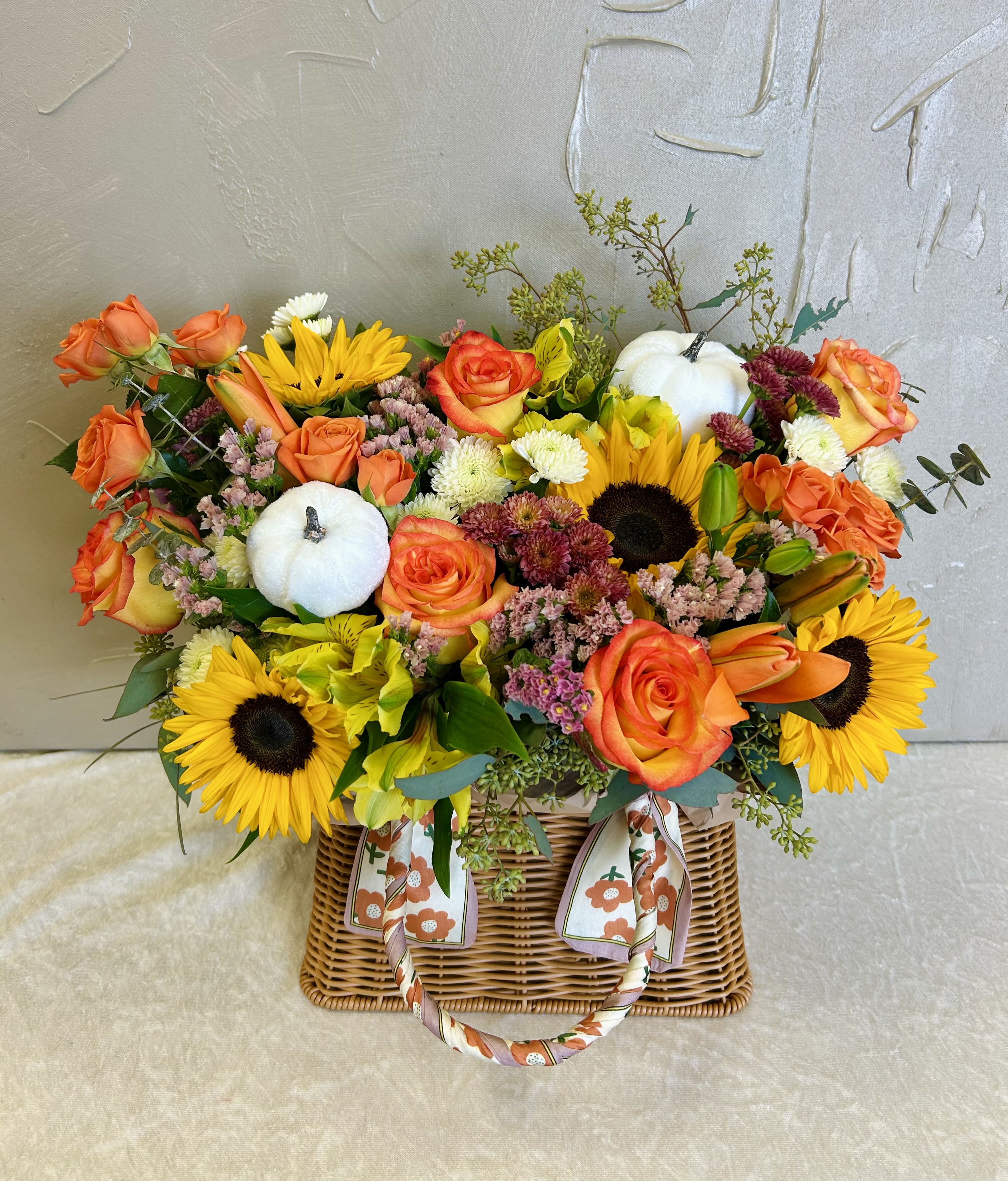 Sunset Radiance Basket  - Captivating like a summer sunset, this stunning arrangement of vibrant roses is beautifully displayed in an elegant Basket making it a gift they'll cherish.