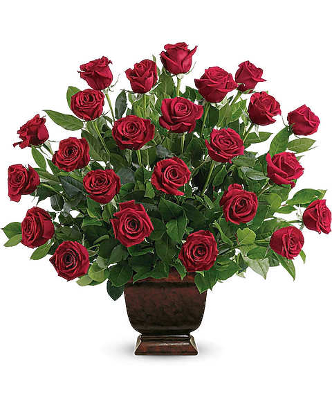 Red roses arranged in a dark urn vase