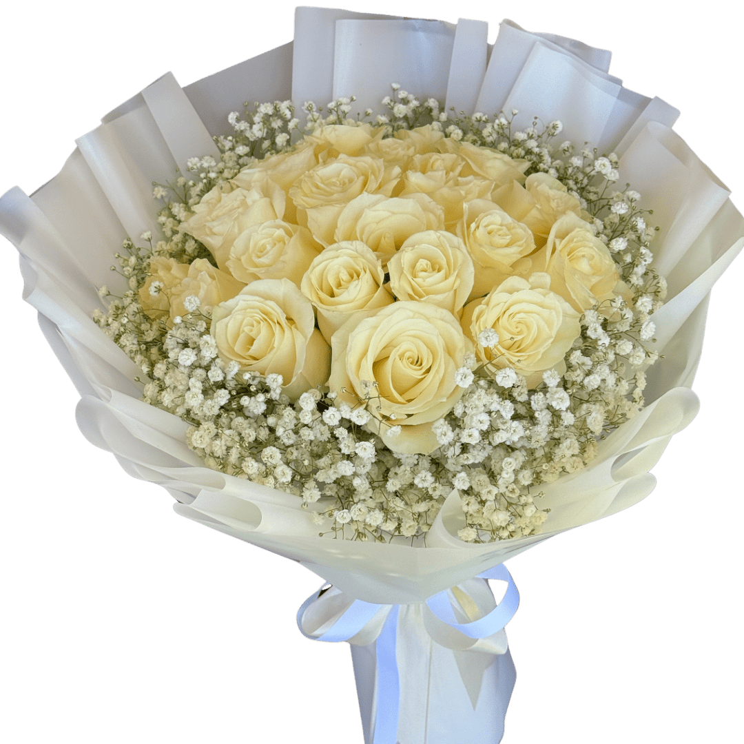 Bouquet of pale yellow roses with baby's breath wrapped in white paper