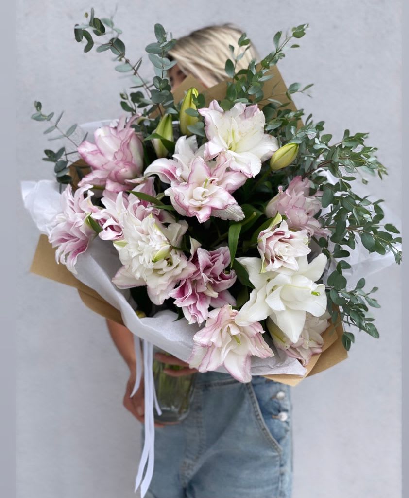 Lilies bouquet - Amazing bouquet of premium fragrant lilies ! This stunning bouquet features luxurious rose lilies, known for their large, elegant blooms and delicate fragrance. The flowers open beautifully into soft layers of blush pink and creamy white petals, creating a romantic and sophisticated look. Designed with fresh seasonal greenery and wrapped in a modern natural style, this bouquet feels airy, graceful, and timeless. Rose lilies are especially loved because they are pollen-free, making them perfect for homes, offices, and hospital deliveries. Each bouquet is handcrafted with the freshest flowers to ensure long-lasting beauty and an unforgettable presentation. Perfect for birthdays, anniversaries, congratulations, thank-you gifts, or simply to brighten someone’s day.  Available for same-day flower delivery in Los Angeles.  Order this elegant rose lily bouquet from Mercury Flowers – luxury flower delivery in Los Angeles and send a gift that feels truly special!