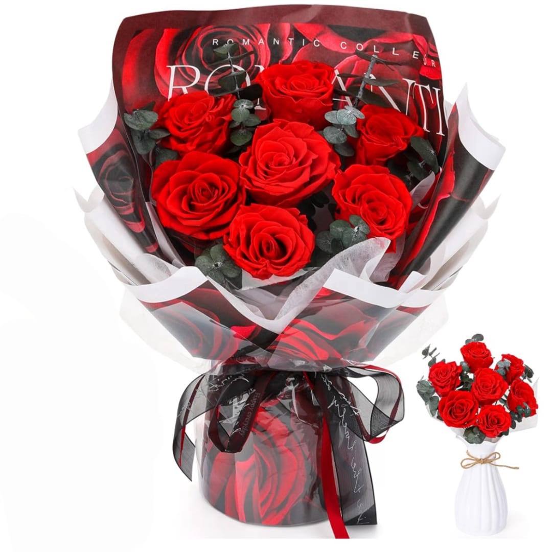 Bouquet of red roses wrapped in black and white paper with a ribbon