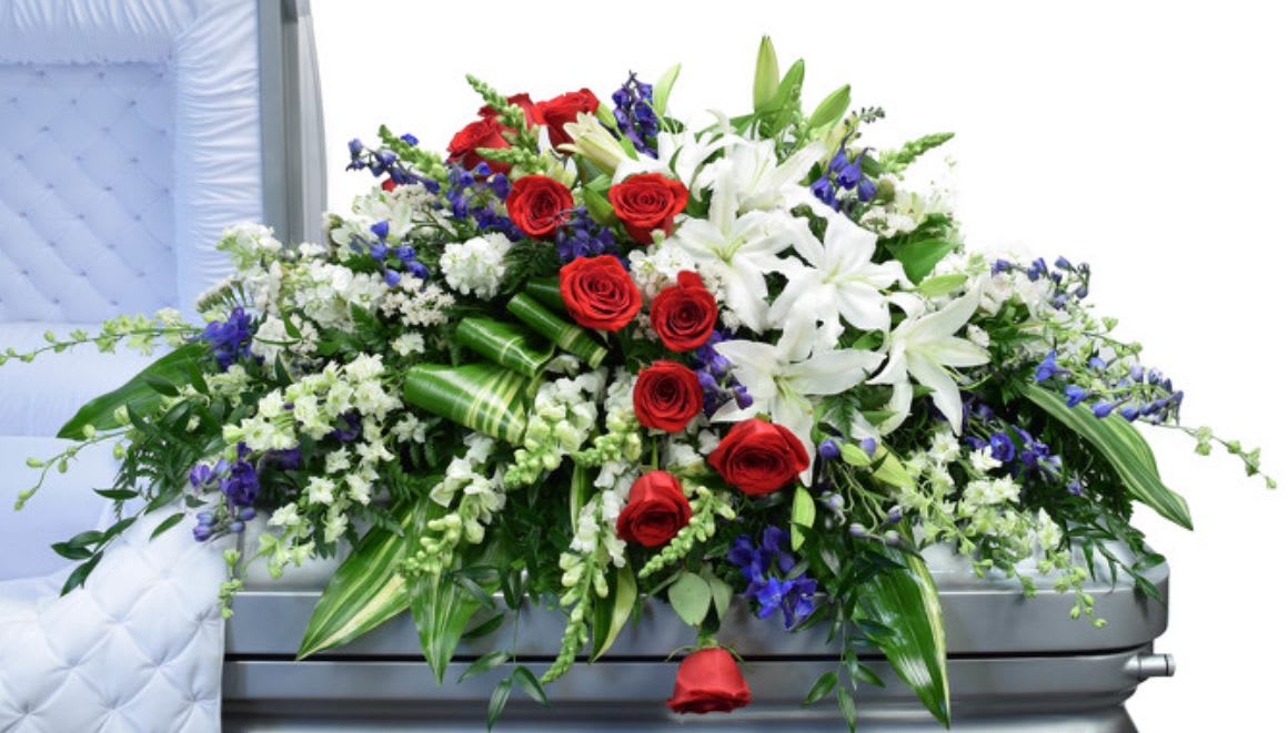Stars and Stripes Casket Spray - Stars and Stripes is a meaningful choice for commemorating your beloved veteran, proud patriot, or anyone whose life embodied resilience, devotion, and unwavering spirit. 