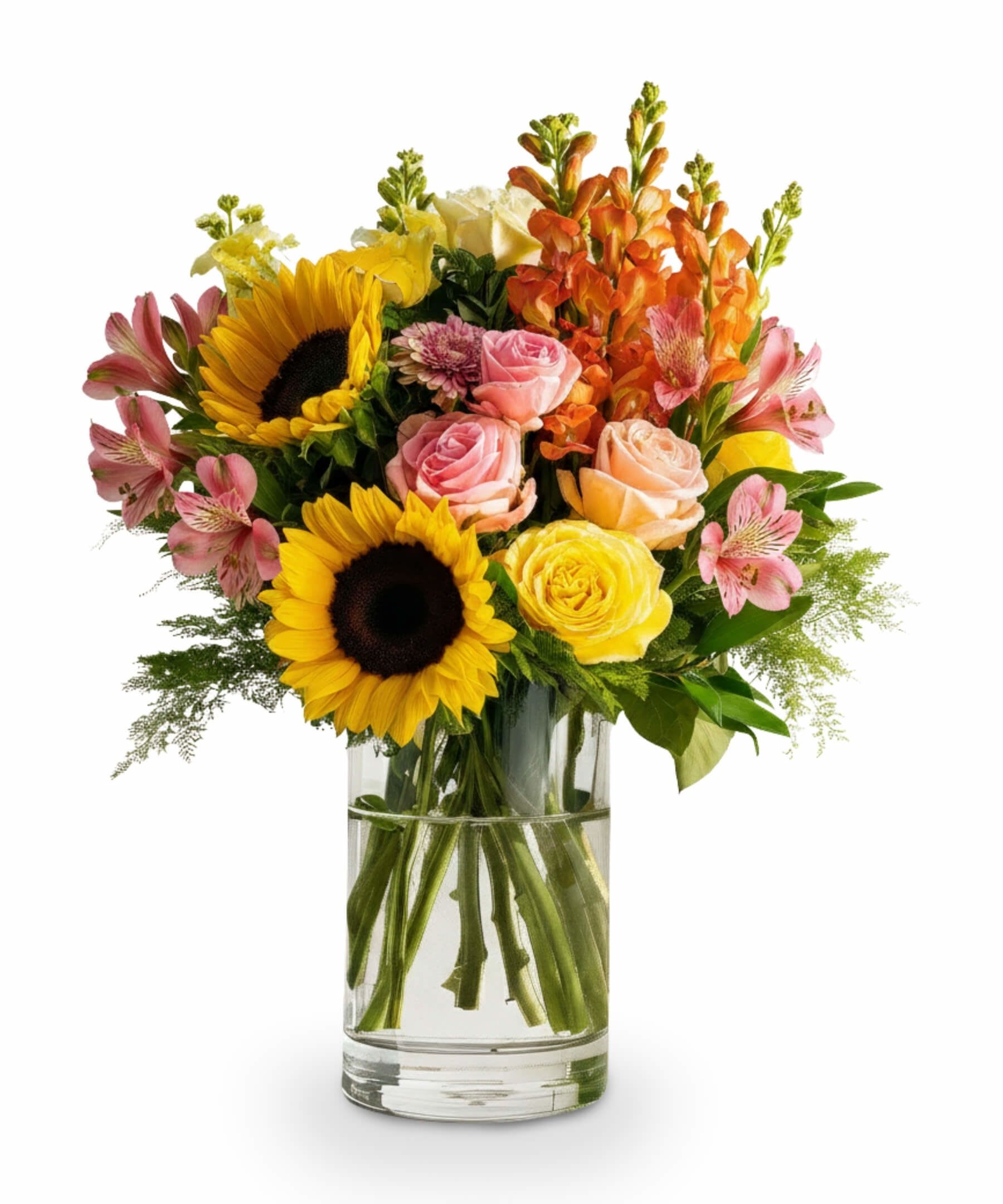 Summer Citrus Glow - Bursting with radiant summer energy, Summer Citrus Glow is a celebration of warmth, joy, and color. Featuring sun-kissed sunflowers, juicy orange snapdragons, zesty yellow roses, and refreshing blush-toned blooms, this bouquet brings the feeling of a sunny garden straight indoors. Designed in a clear glass cylinder vase with water, it's the perfect centerpiece for summer gatherings or to brighten someone’s day with a splash of sunshine and elegance.