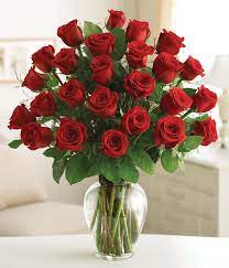 Two Dozen Red Roses In Vase - These two dozen red roses provides the classic romantic gift. It's perfect for Valentine's Day or an Anniversary. Available in all red or mixed colors.