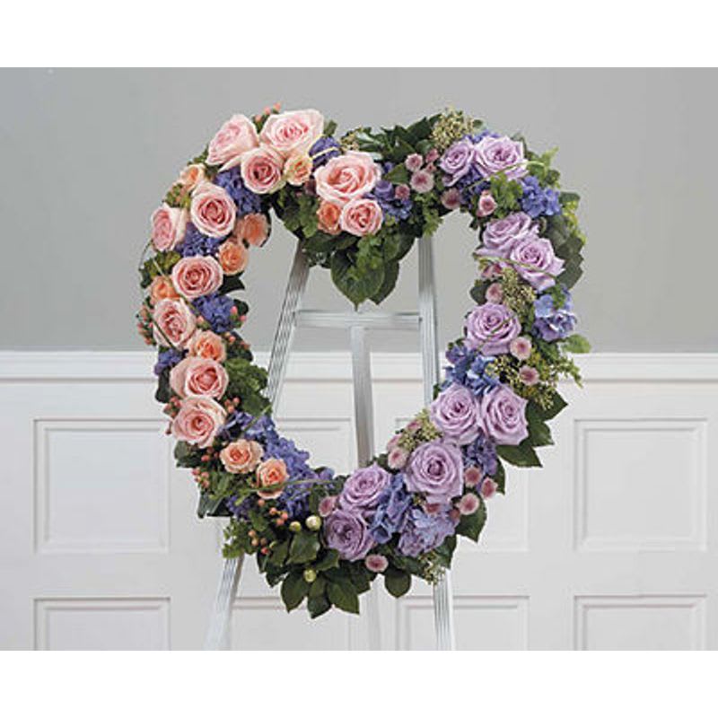 Soft Open Heart - Open heart with pink and lavender roses lavender button pomps and blue hydrangea.