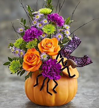 Spider Pumpkin  - A not so scary Spider made out of a carnation. In a festive floral arrangement in a Pumpkin 