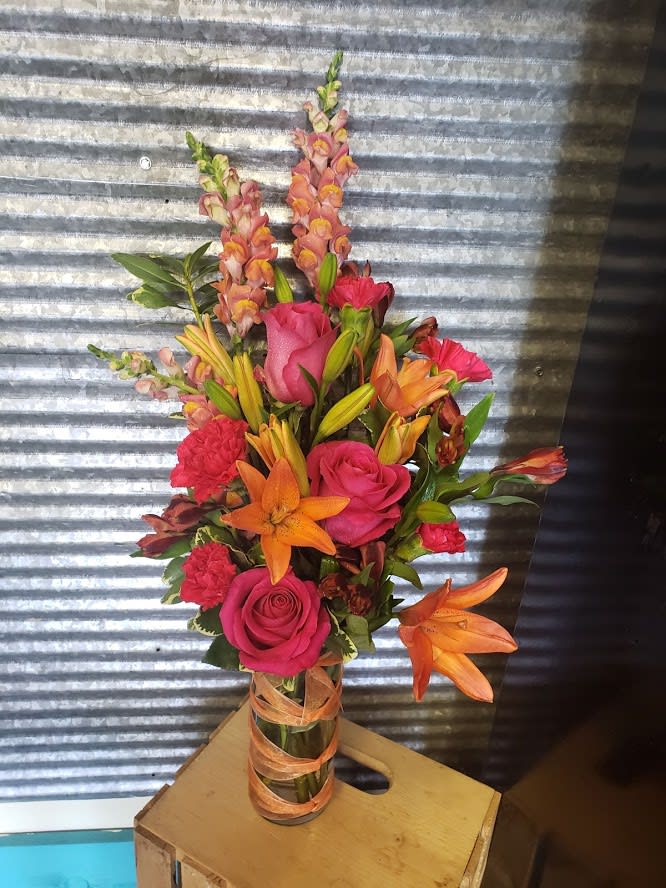 Orange Crush  - Ribbon vase with Hot pink roses, Orange Lilies and snapdragons 