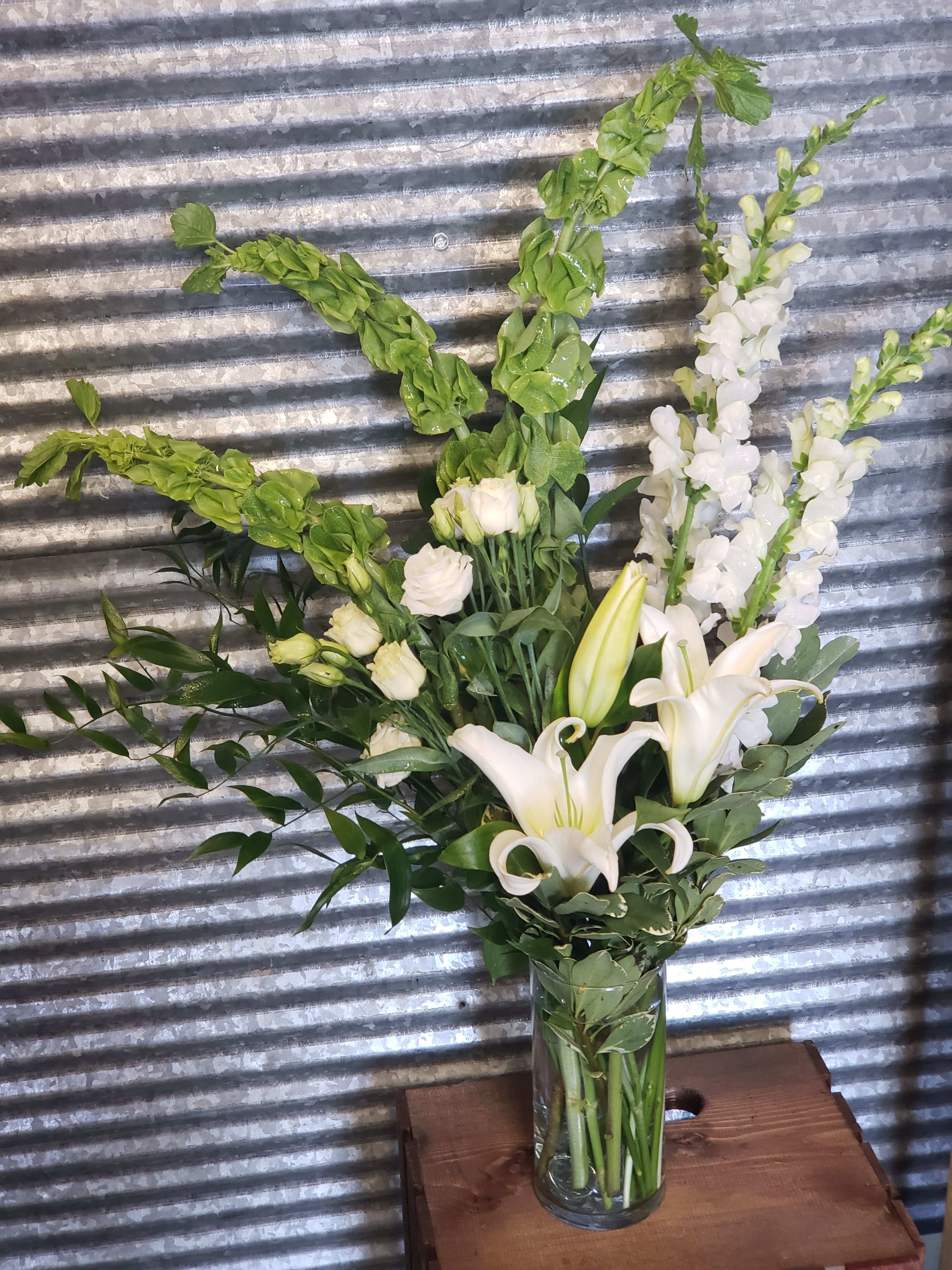 Bells of Ireland mixed Arrangement - Can you hear the bells of Ireland Ringing? Well you can see them in this beautiful Green and white mixed arrangement. Great for any St. Patrick's day Celebration 