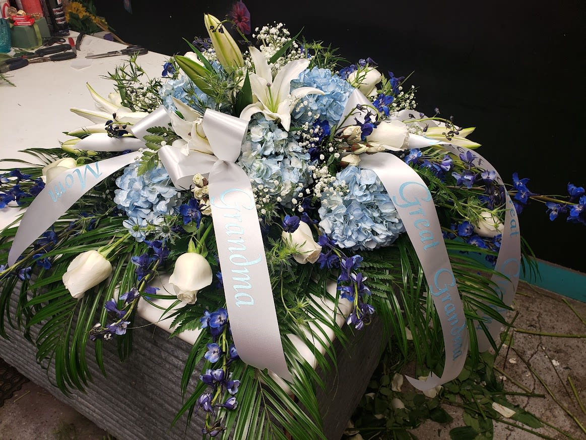 Blue and White casket Spray  - Tasteful Blue and white flowers for a casket 