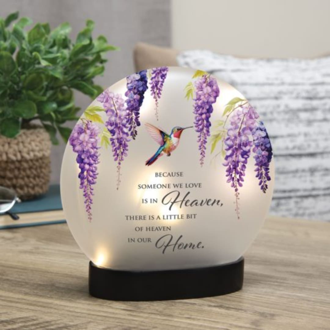 Decorative memorial light with purple wisteria and a hummingbird quote