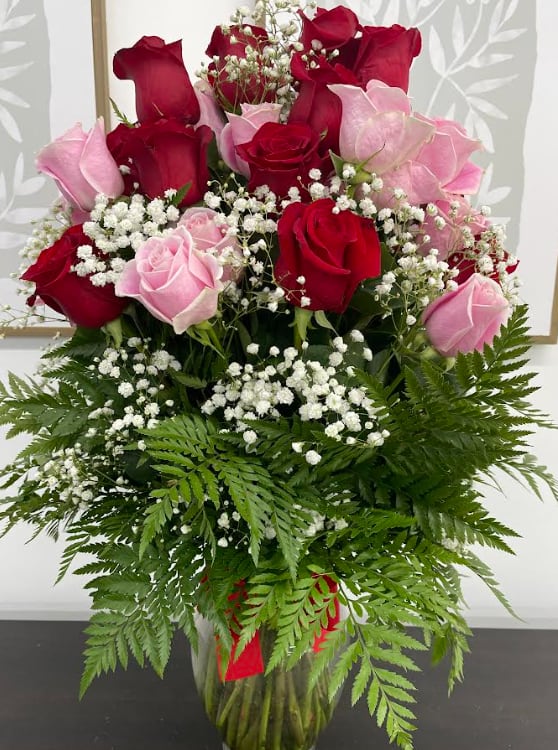 Love Melody - Sing them a love song - with flowers. This lush, loving rose arrangement tells them just how much you care. Standard 12  Deluxe- 24 Premium- 36
