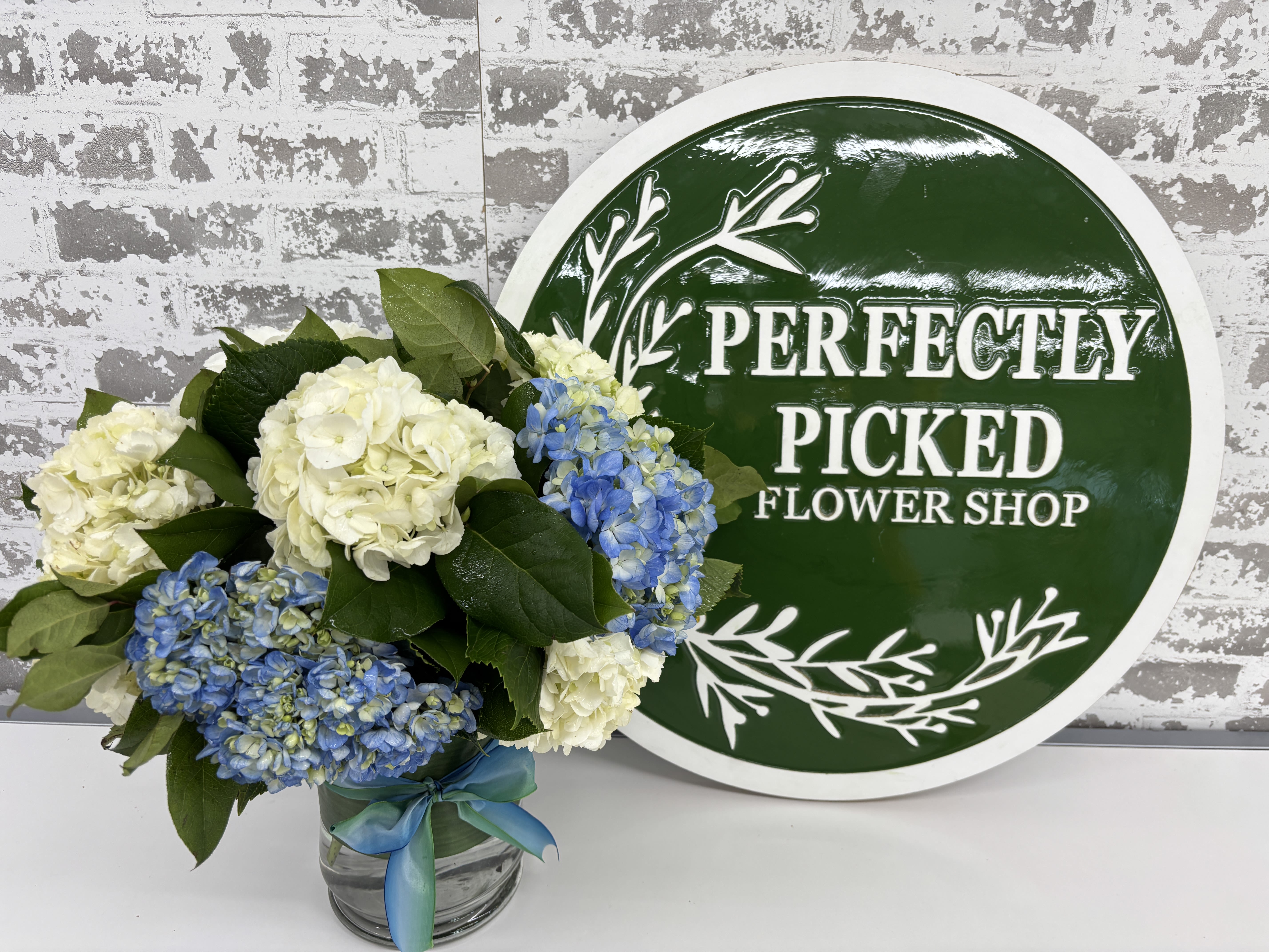 Hydrangea Happiness - Overflowing with rich texture and natural beauty, Hydrangea Happiness delivers a fresh garden-inspired look that feels both sophisticated and comforting. Whether displayed on a dining room table, office desk, or entryway, this arrangement is sure to leave a lasting impression.