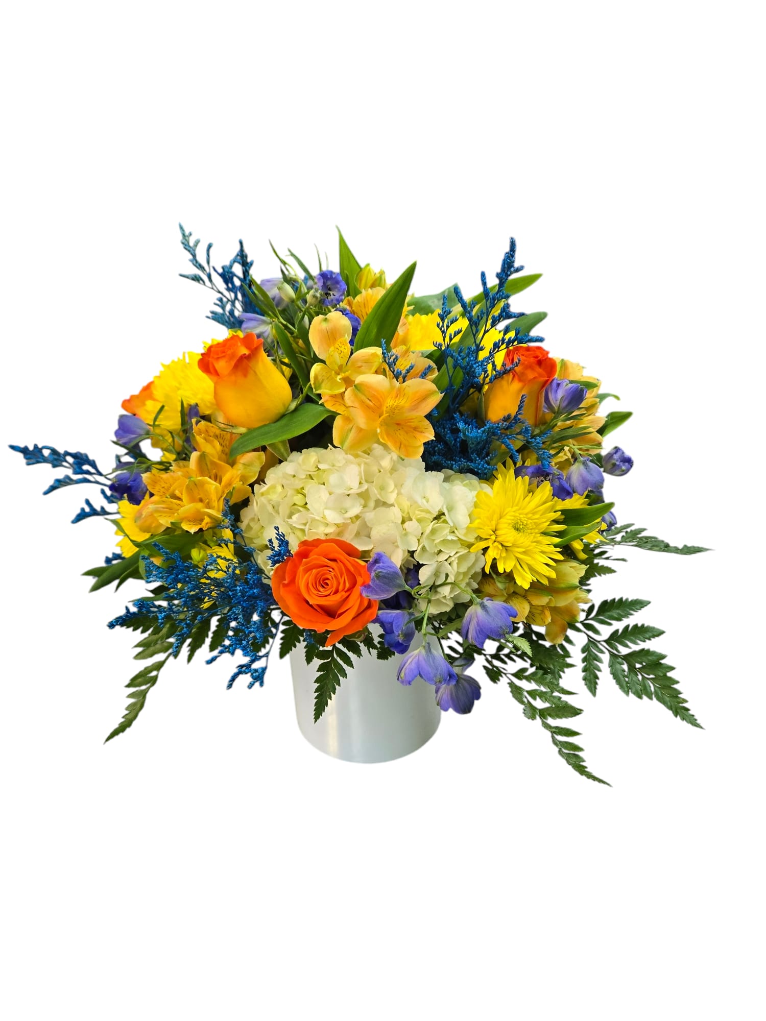 Bright mixed bouquet in a white vase with orange, yellow, blue, and purple flowers