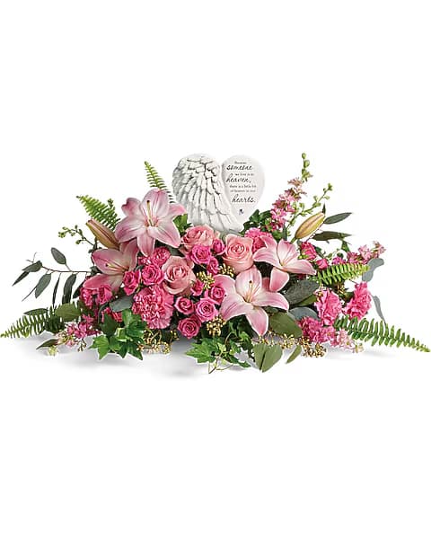 Pink floral arrangement with a heart-shaped memorial stone