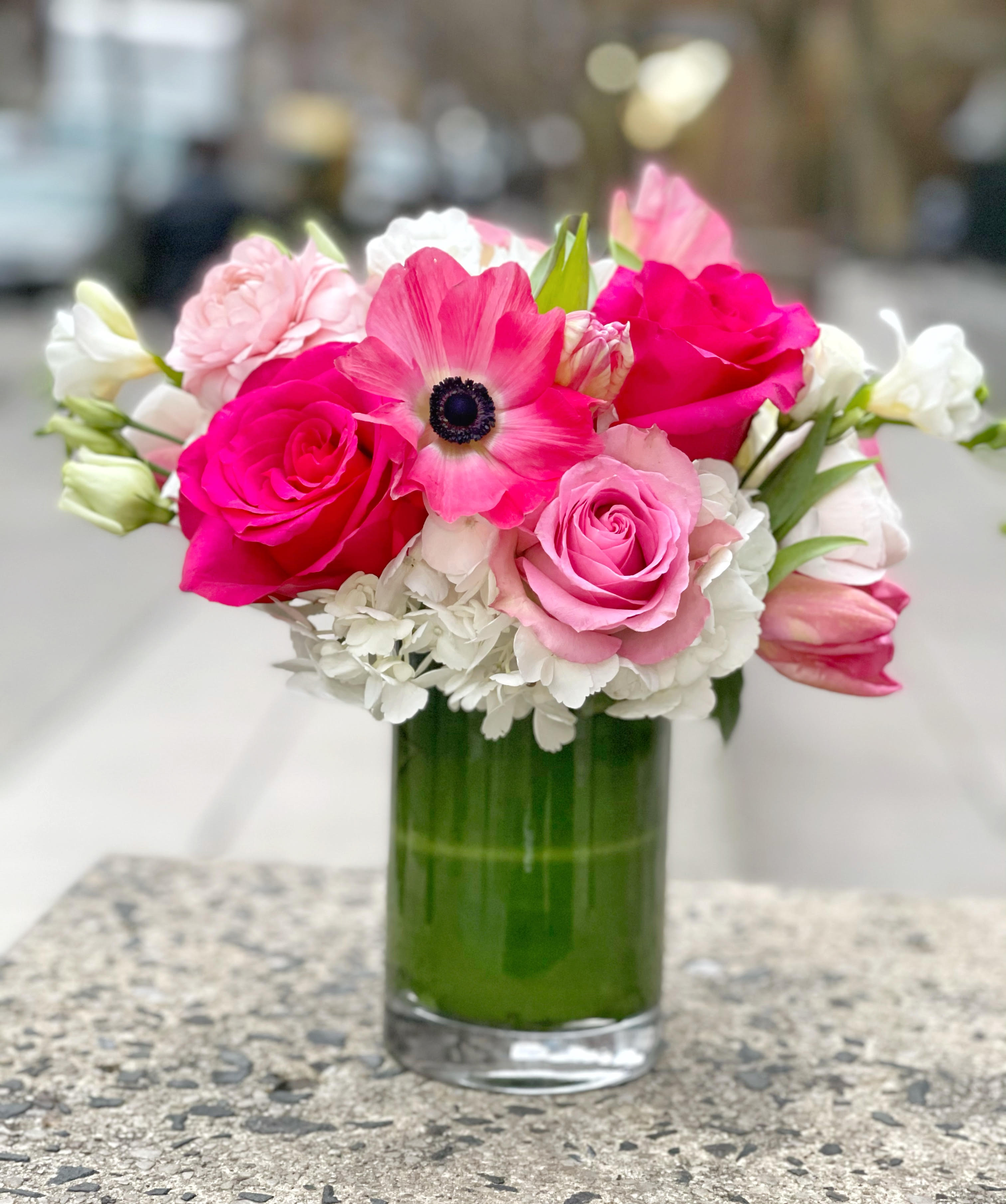 Pink and white bouquet in a clear glass vase