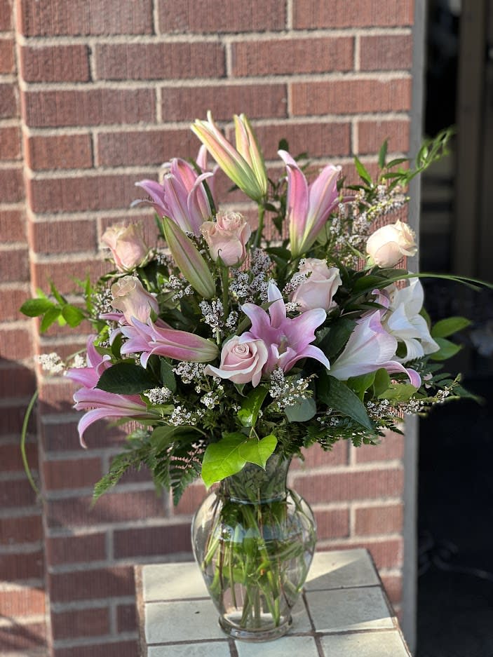 Shades of Pink - A fun, festive mix of pretty pink blossoms – including fancy fresh flowers such as roses, lilies and stock, in complementary blushing tones – creates a magnificent display that’s a lovely gesture for a birthday, anniversary or other special day.