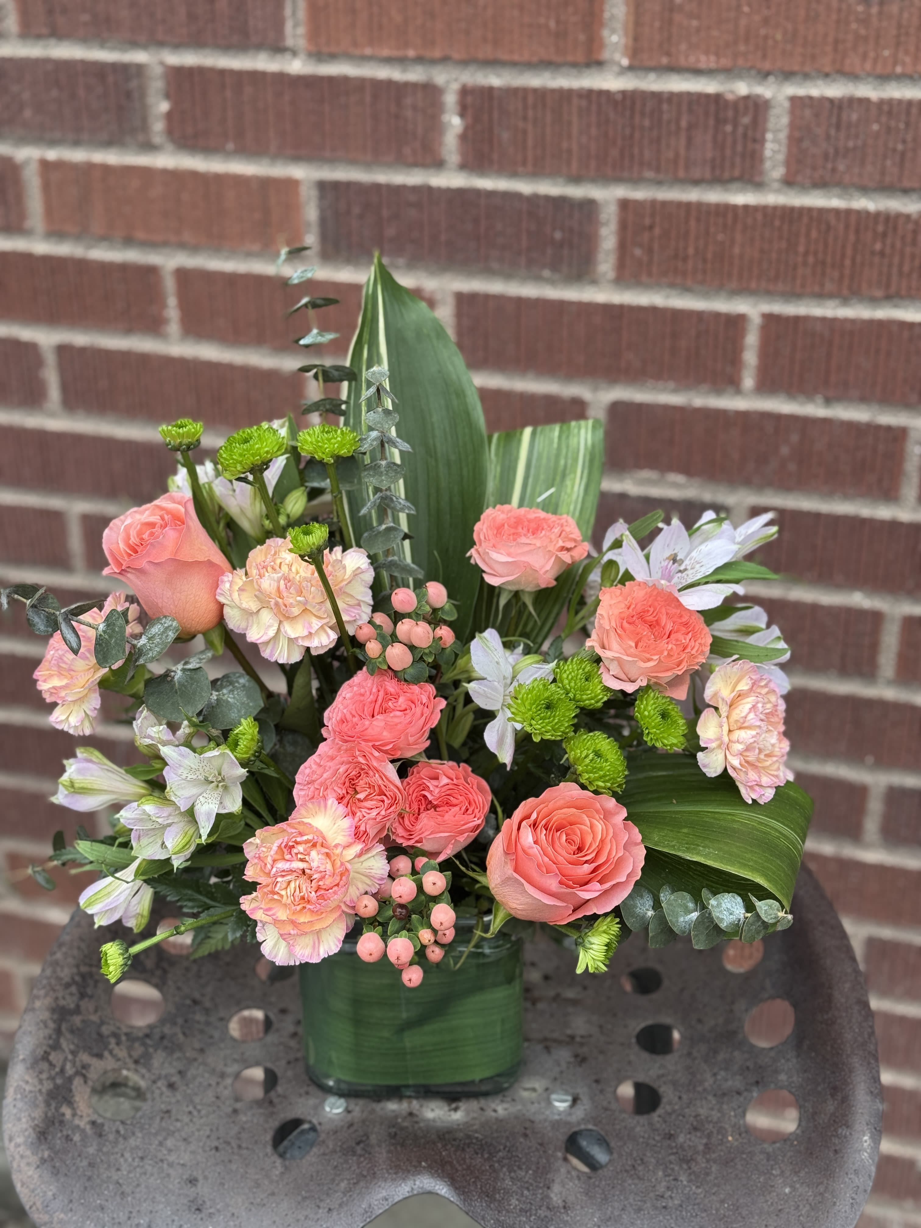 Sunset Splendor - Inspired by the warm peach skies and crystal blue waters of a tropical sunset, this fun-filled rose bouquet adds a splash of happiness to any occasion! 