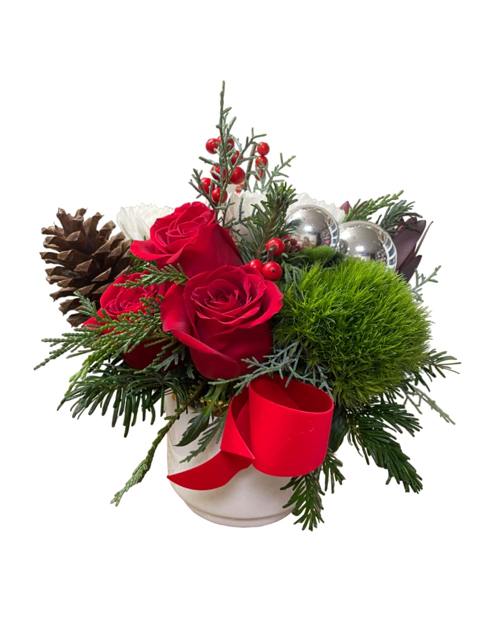 Red roses in a white vase with pinecones and a red ribbon