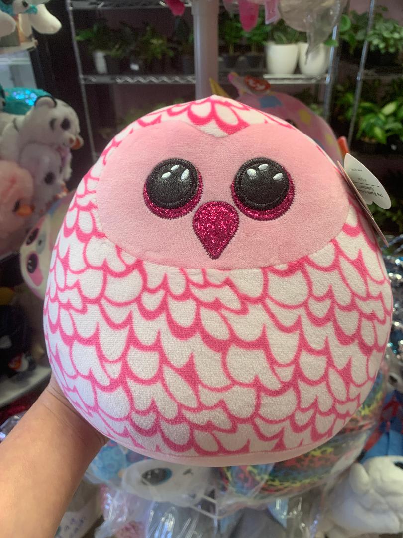 Pink and white owl plush toy with glittery eyes