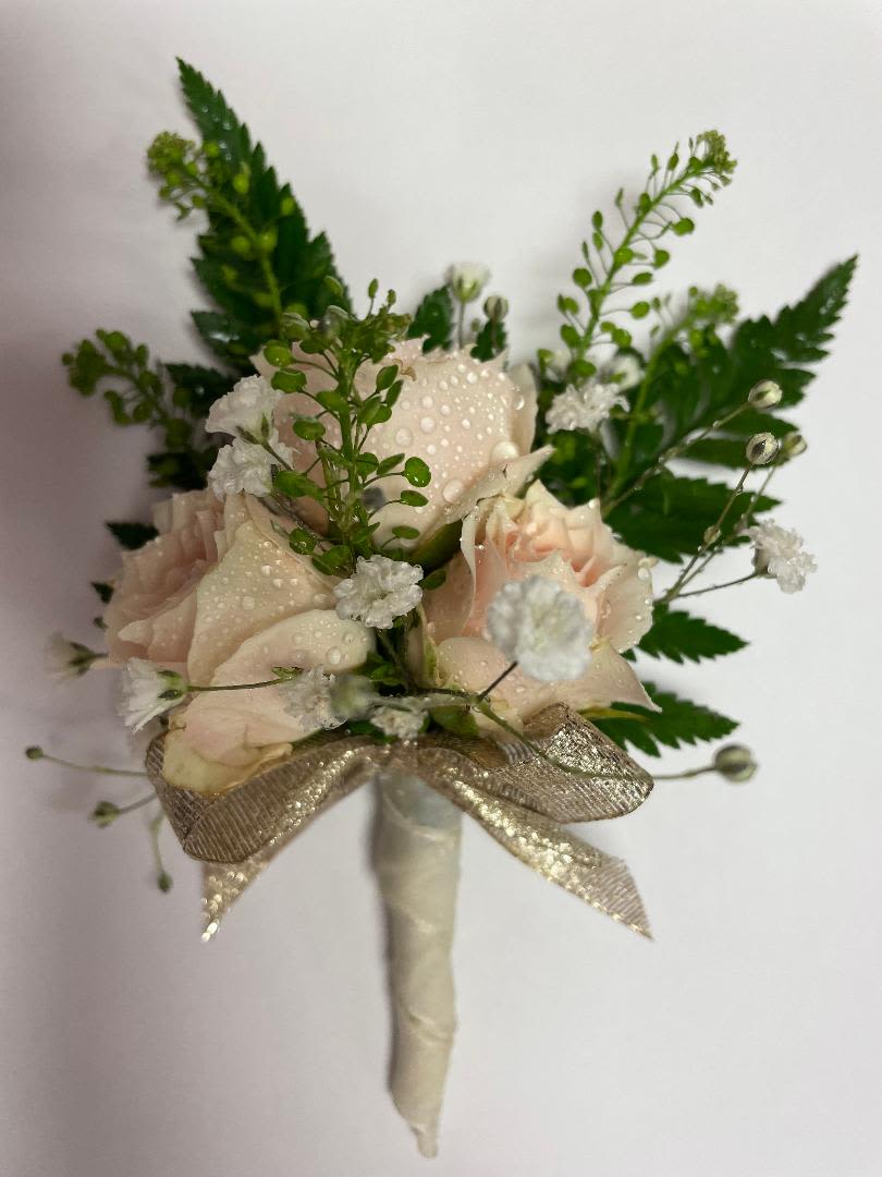 Small blush rose bouquet with white filler flowers and a gold ribbon wrap