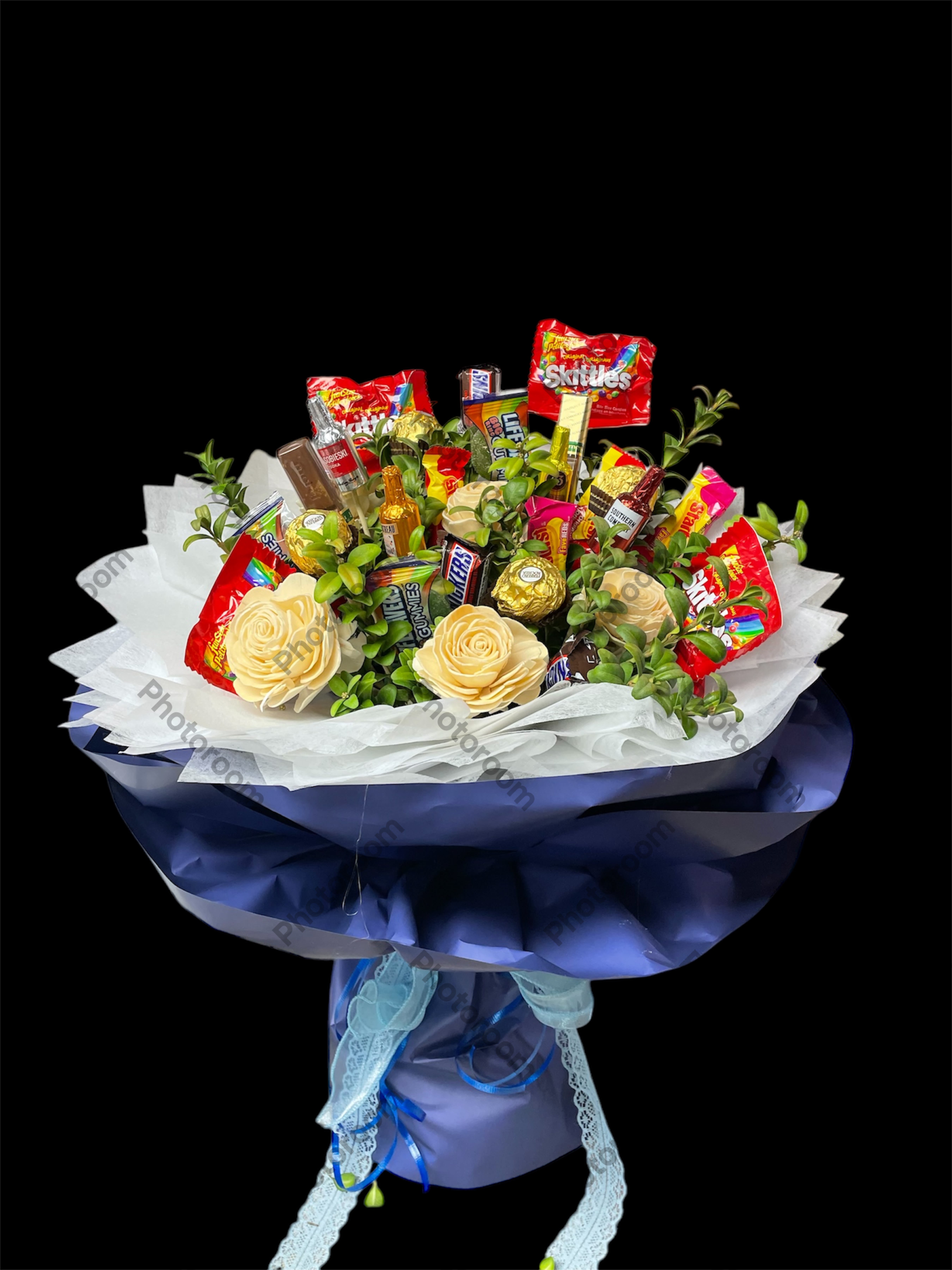 Candy bouquet with faux cream roses and assorted wrapped sweets