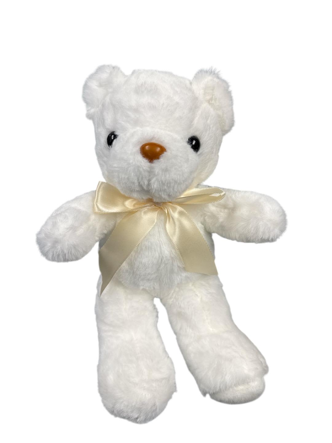 White teddy bear with a cream ribbon bow