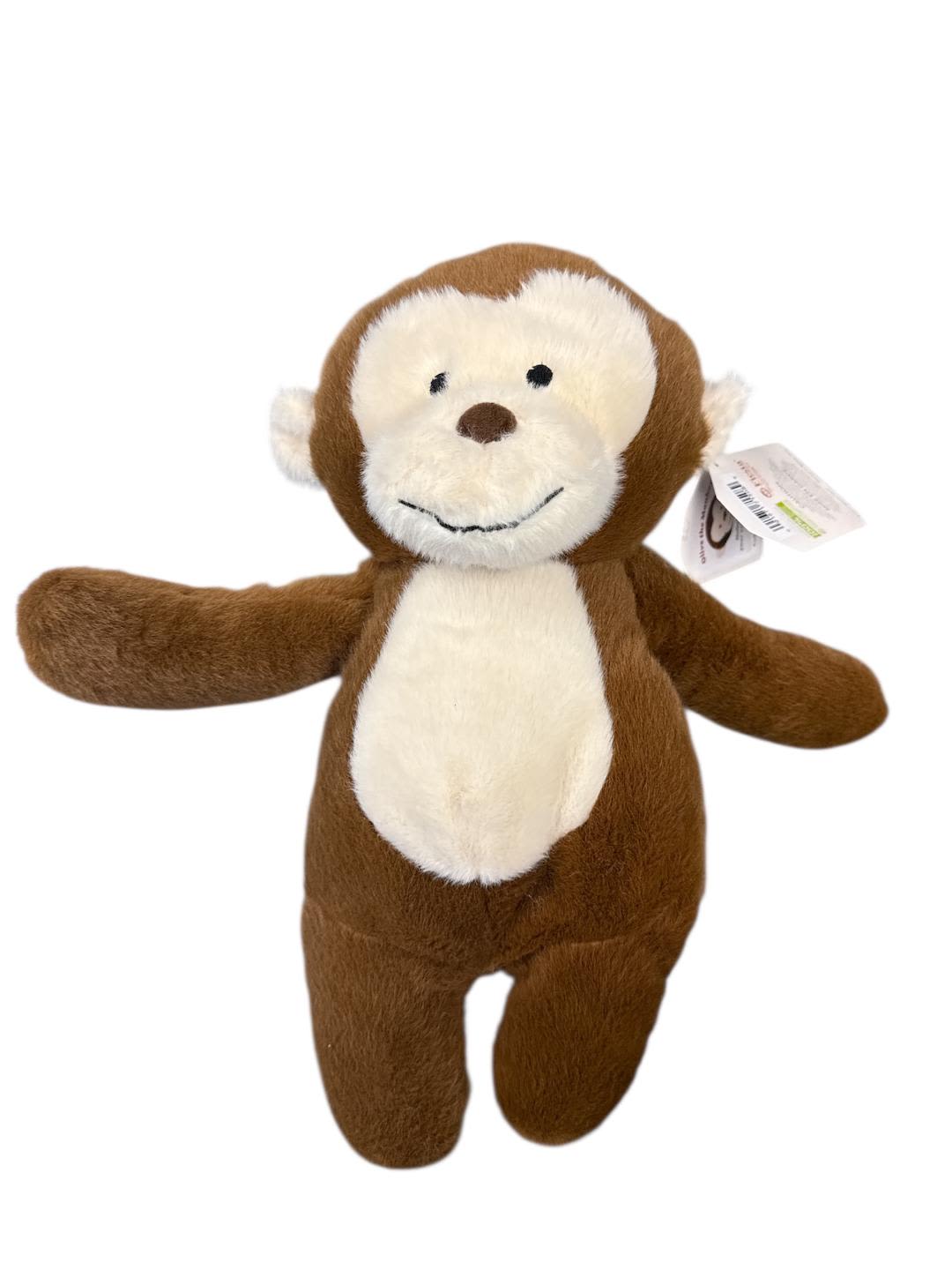 Brown and white plush monkey toy with outstretched arms
