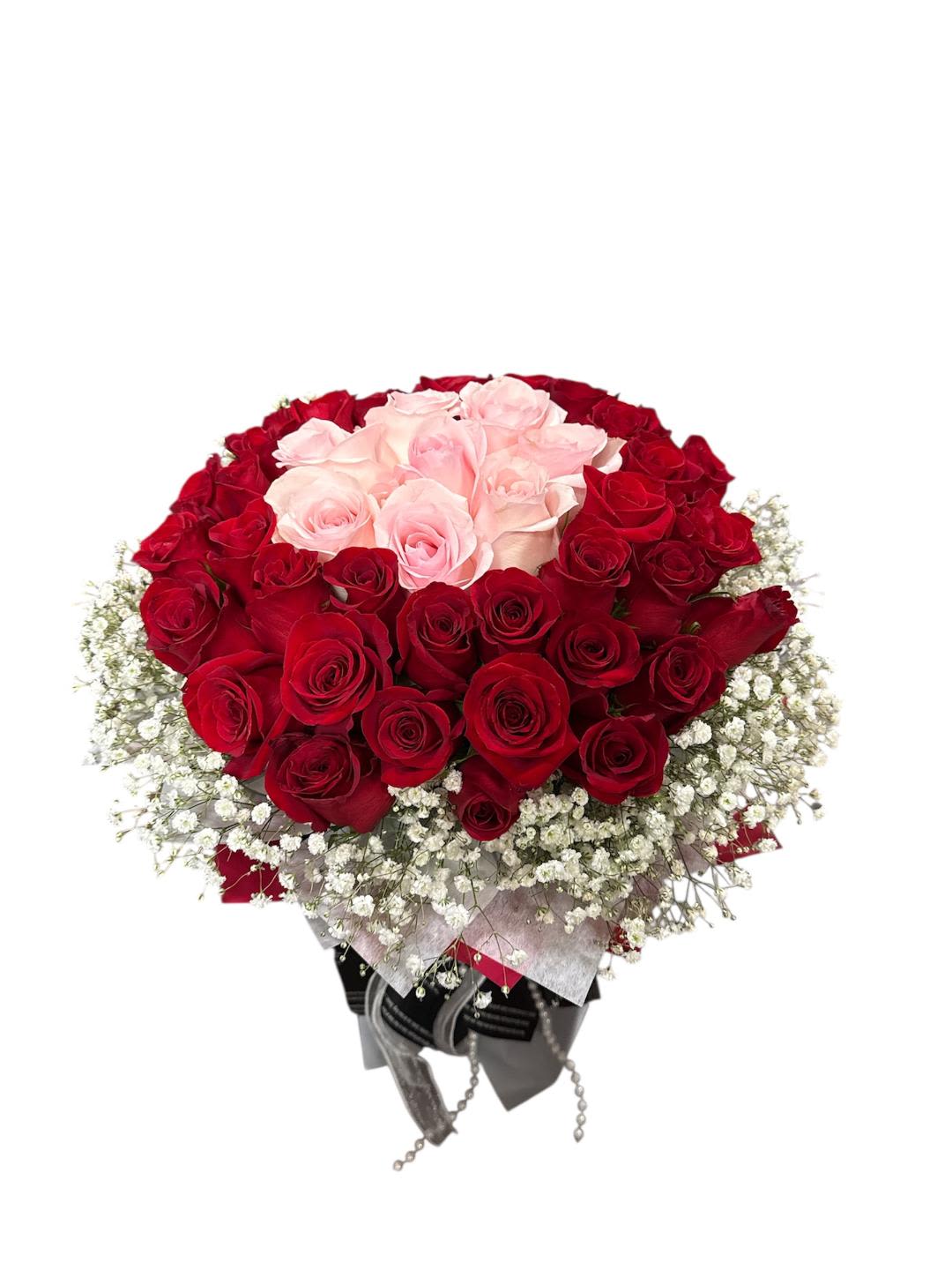 Bouquet of red and pale pink roses with baby's breath