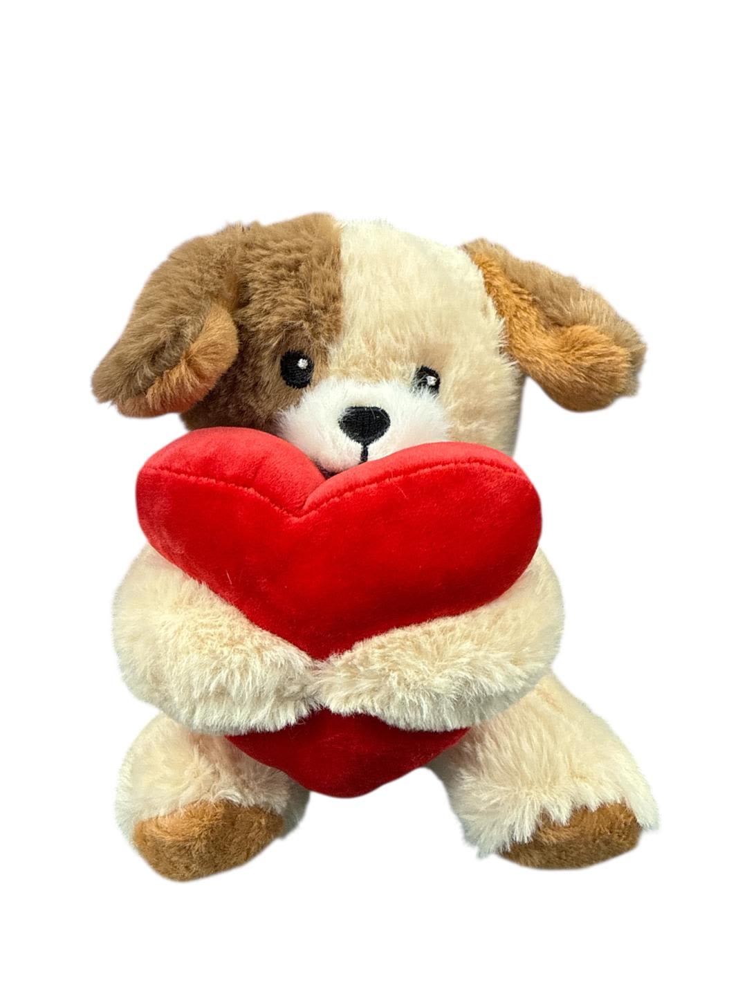 Plush puppy holding a red heart