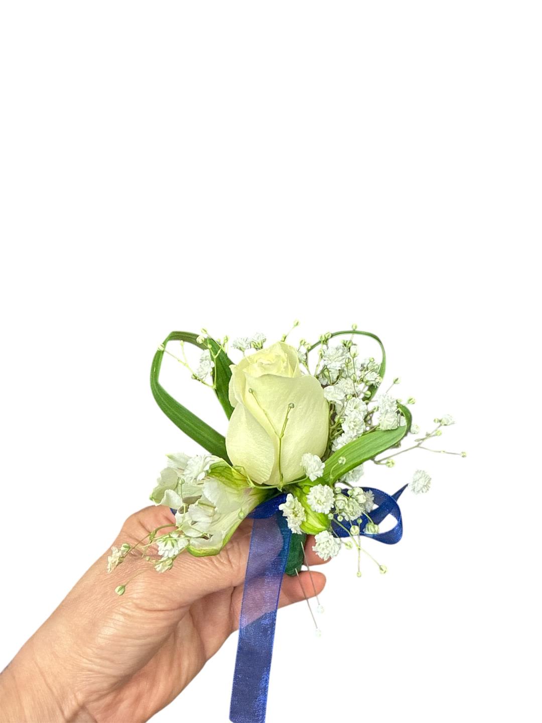 White rose boutonniere with baby's breath and blue ribbon