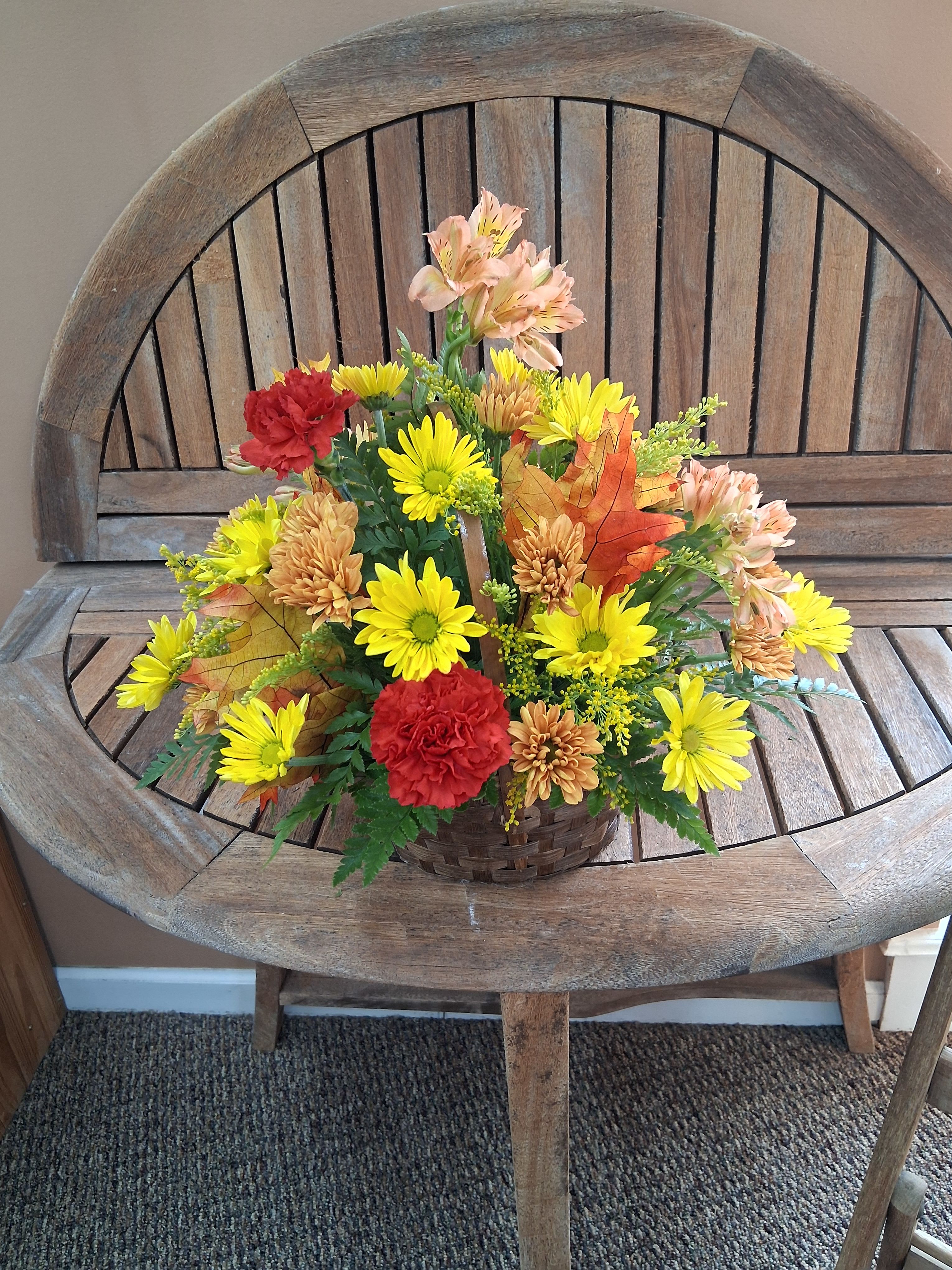 Simply Fall - Mixed fall colored flowers in a basket.