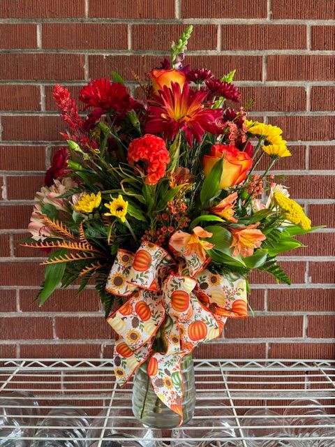 SPICE....AND EVERYTHING NICE - A fresh floral arrangement that is filled with warm fall spice colored flowers that is sure to make everything nice in your life.