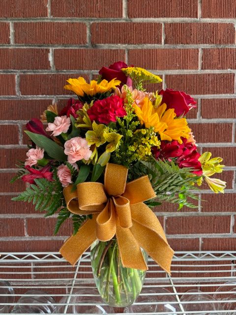 SUNSET - A fresh floral arrangement of fall colors that remind you of a breath taking sunset.