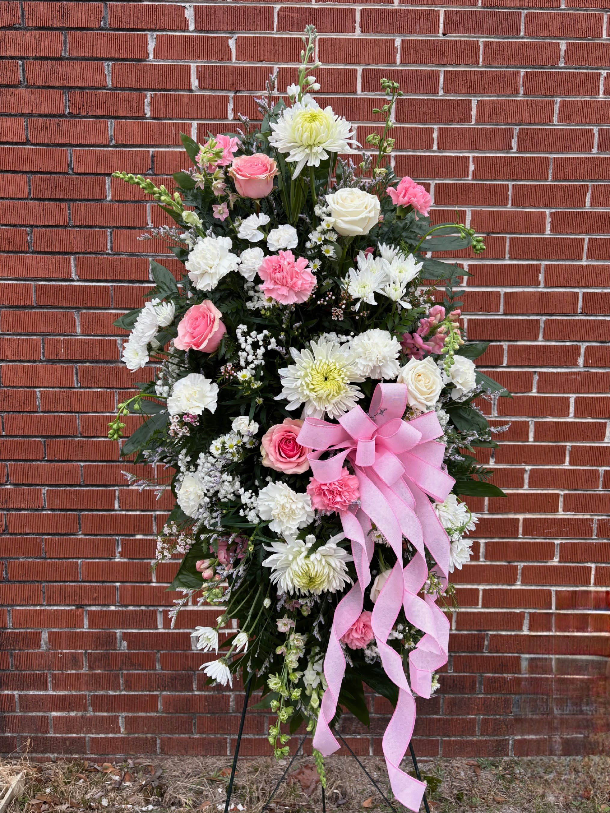 HOPE - A STANDING SPRAY OF WHITE AND PINK FLOWERS.