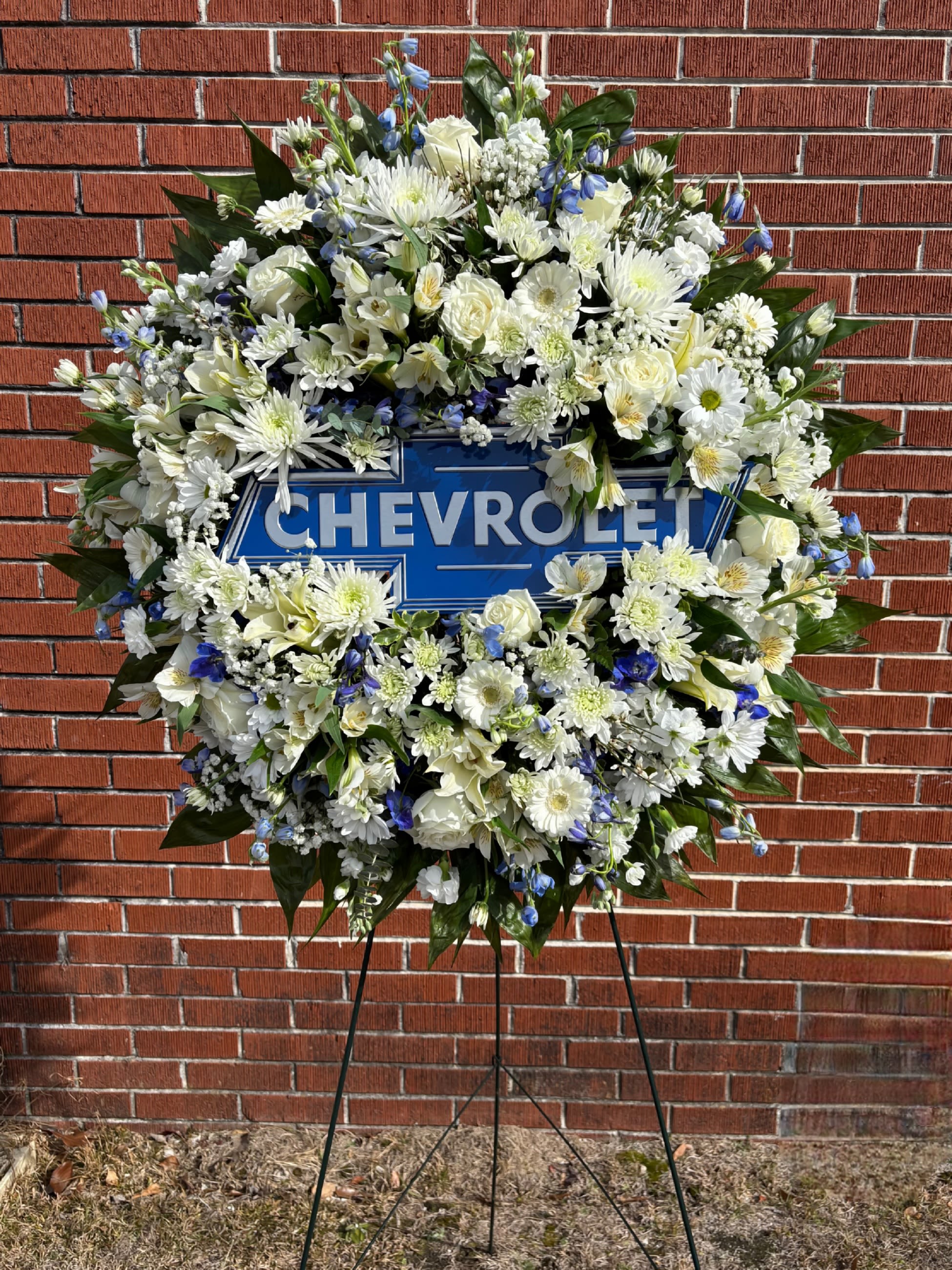 LOVING TRIBUTE - FRESH FLORAL WREATH IN WHITES AND BLUES. SIGN SOLD SEPERATELY.
